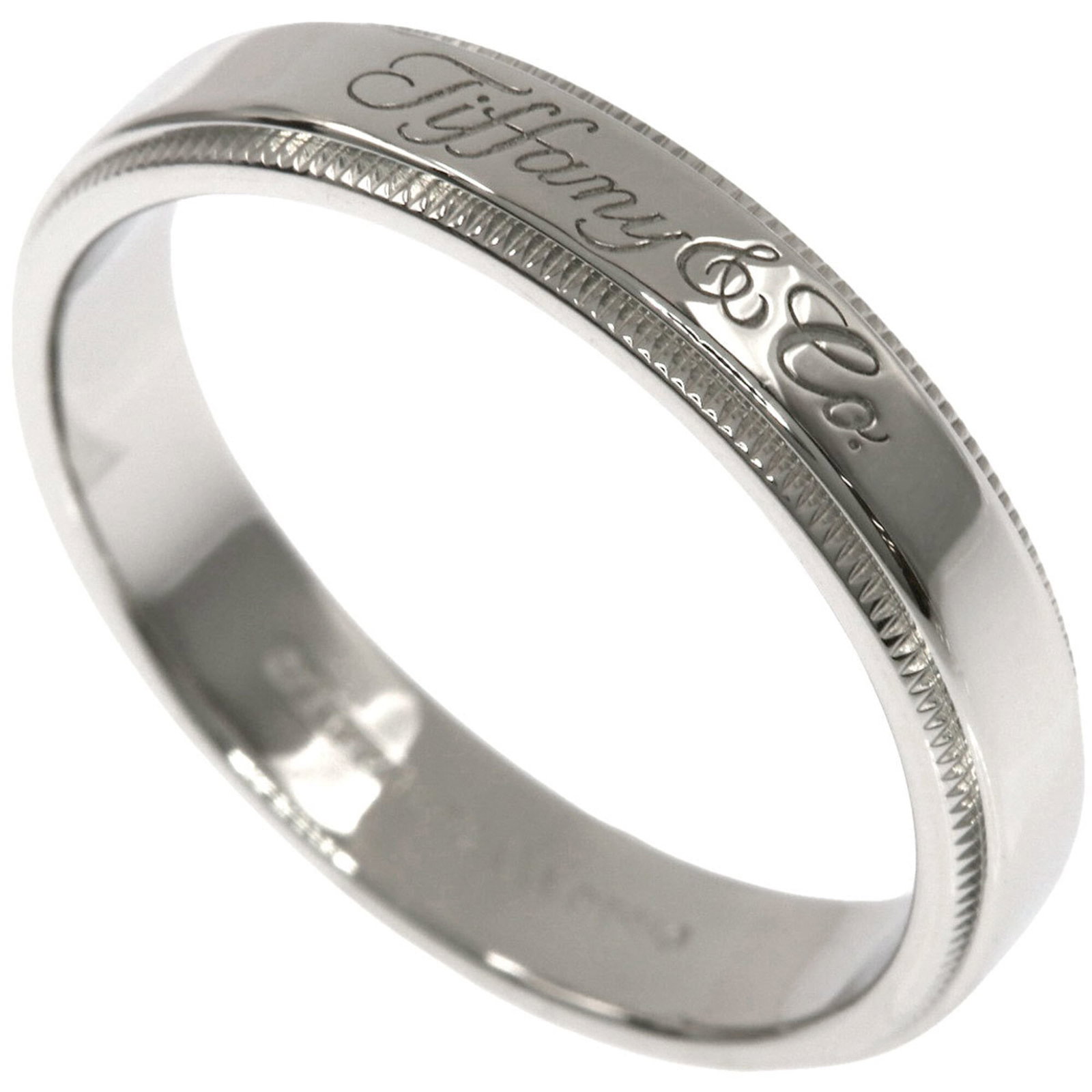 Tiffany Band Ring Platinum 950: Tiffany Band Ring Platinum 950 Platinum 950 Tiffany Band Ring in excellent condition, featuring a sleek design with subtle scratches and minor dirt marks. The ring's high-quality construction ensures 