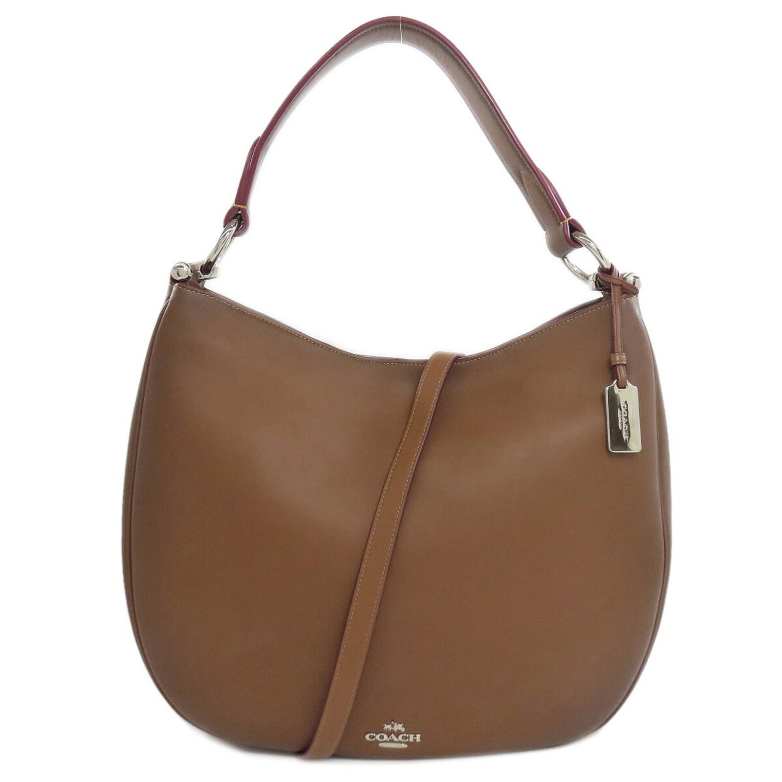 Coach Shoulder Bag Leather: Coach Shoulder Bag Leather This Coach shoulder bag features high-quality leather construction and a classic design. With its spacious interior, including two zippered pockets and an open pocket, it pr