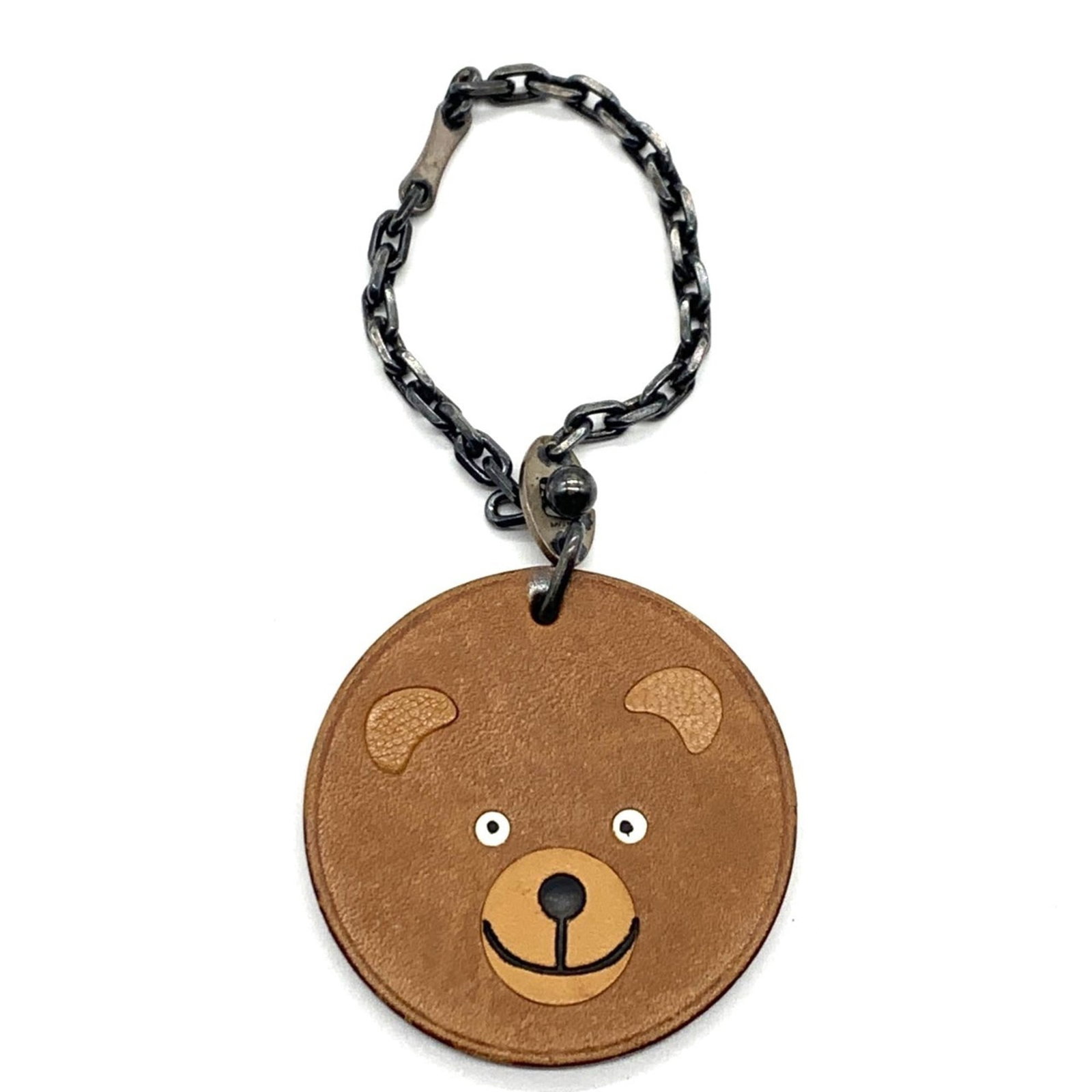 Hermes Keyring Leather: Hermes Keyring Leather This Herm?s keyring leather features a classic brown leather design with visible scratches and dirt, giving it a worn-in look. Made from high-quality leather, its compact size