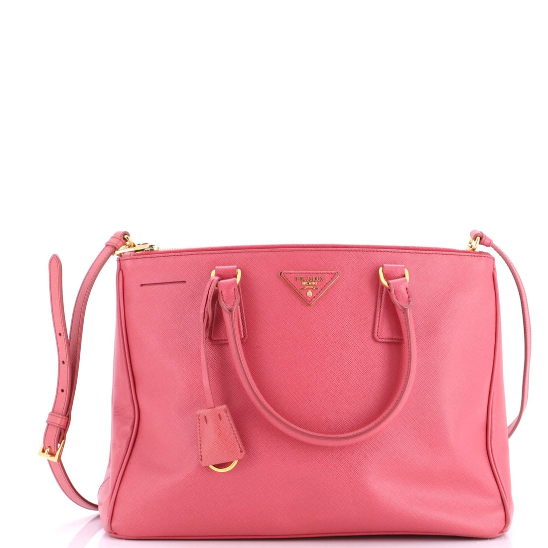 Double Lux Leather Saffiano Tote Prada: Double Lux Leather Saffiano Tote Prada Pink Saffiano Leather Double Lux Tote from Prada features a medium size with a gold clochette and strap. The exterior has creases, corner wear, and cracking, whi