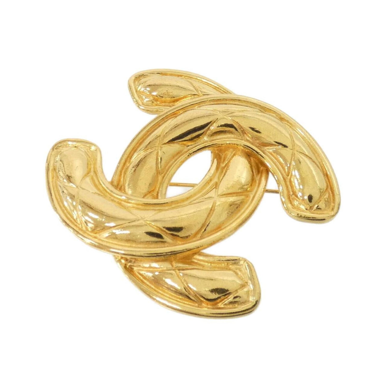 Chanel Brooch: Chanel Brooch Chanel's iconic design shines through in this gold brooch, featuring a few subtle traces of usage and minor scratches. The item remains in very good condition, with some dirt visible but