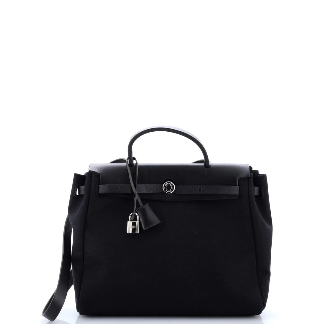 Hermer Hargem Toil PM: Hermer Hargem Toil PM The Hermer Hargem Toil PM features a sleek black leather exterior with canvas accents and a Palladium hardware finish. This stylish handbag boasts a spacious interior with a fabr