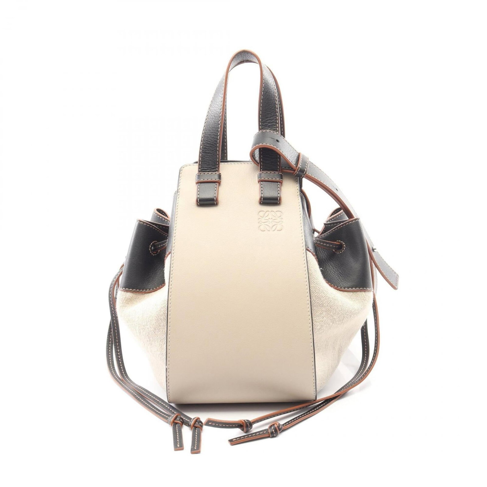 Loewe Handbag Leather Canvas: Loewe Handbag Leather Canvas This stunning Loewe Handbag features a unique blend of leather and canvas materials in a beautiful beige and black color combination. With its classic design and compact s
