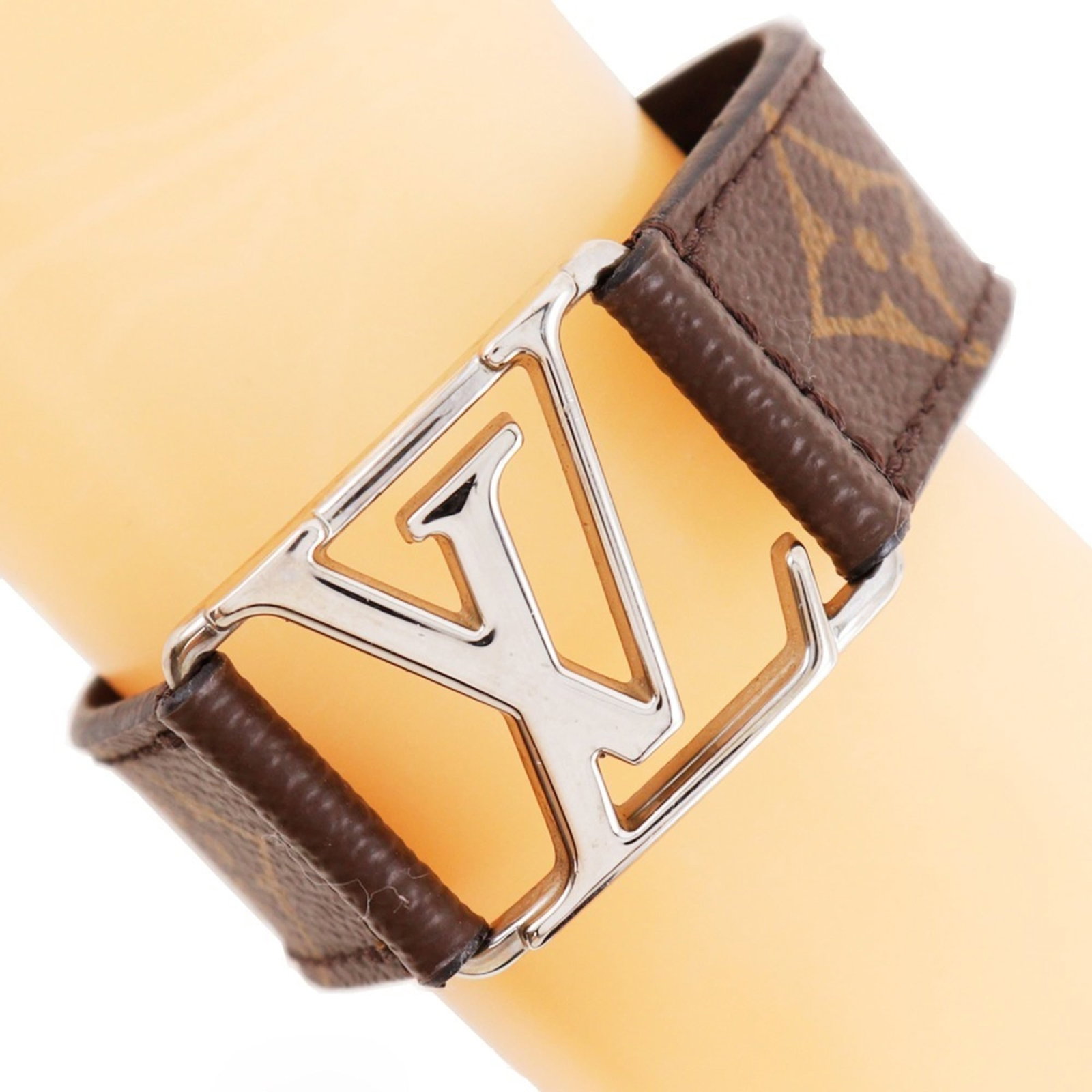 Louis Vuitton Charm Bracelet Canvas Monogram: Louis Vuitton Charm Bracelet Canvas Monogram Canvas Monogram charm bracelet from Louis Vuitton features the iconic brown monogram pattern. With its classic design and timeless appeal, this charm brace