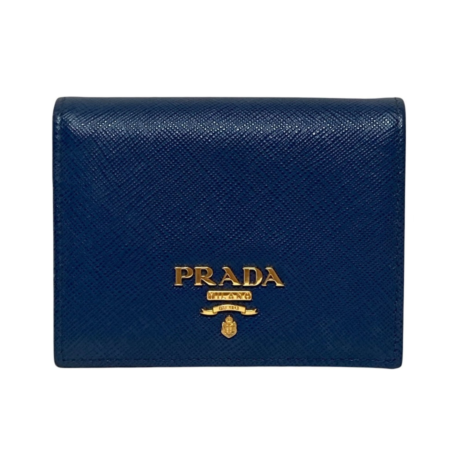 Prada Wallet (Bi-Fold) Leather: Prada Wallet (Bi-Fold) Leather This Prada bi-fold leather wallet features a classic design with a durable blue leather exterior. With its compact size and sturdy construction, it remains in very good 