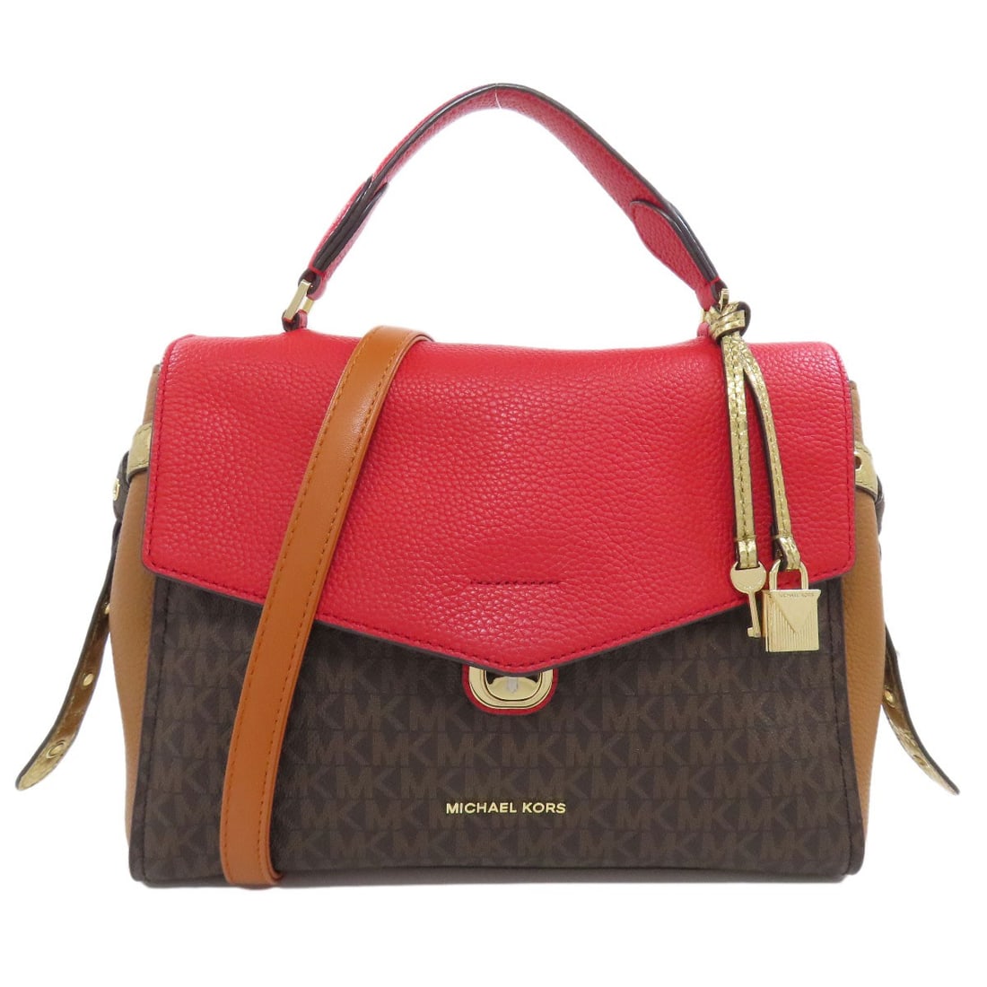 Signature handbag pvc by mk michael kors: Signature handbag pvc by mk michael kors Signature handbag with a striking brown and red PVC exterior. Notably made from PVC, this Michael Kors design showcases a unique color combination. The bag fea