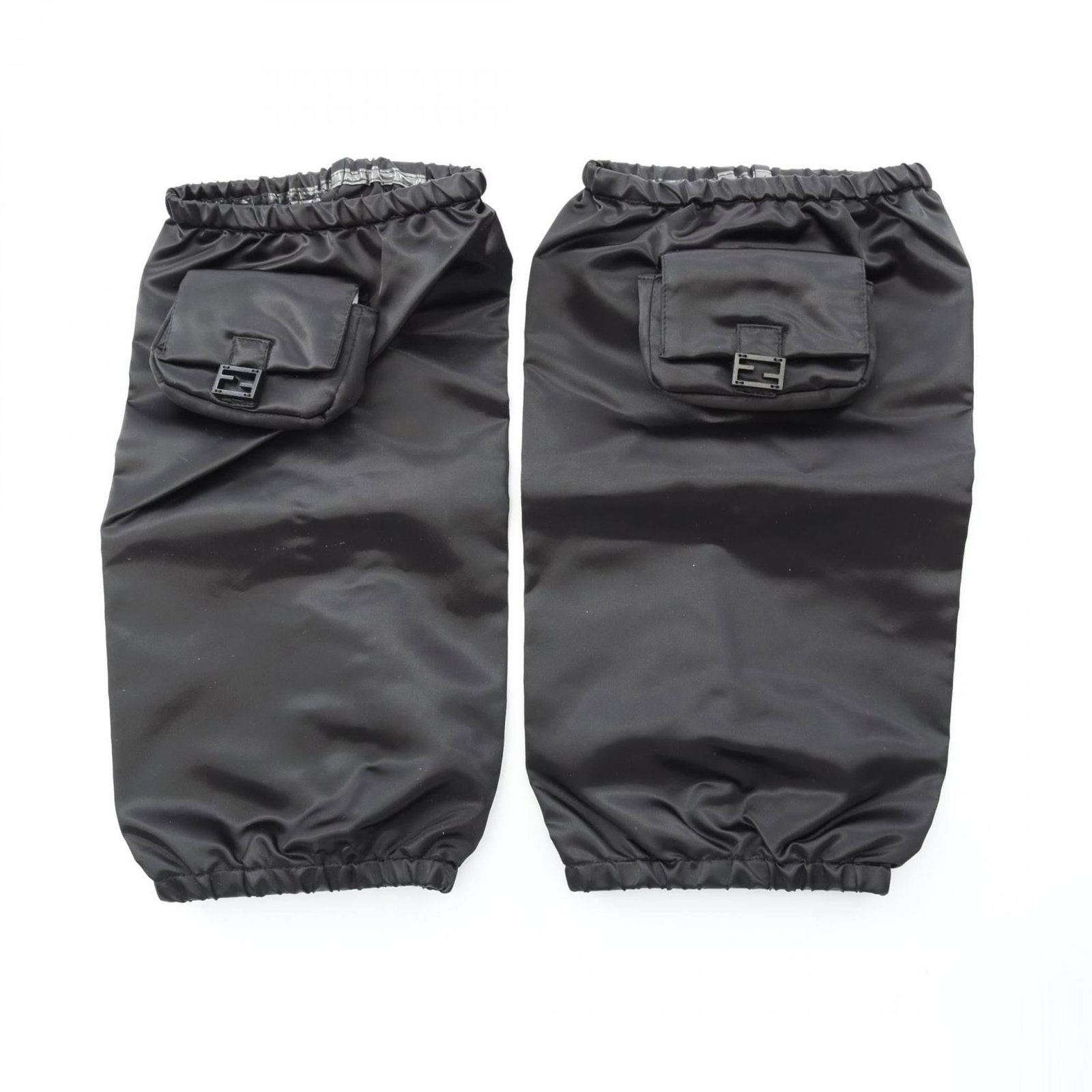 Fendi Legwarmers Nylon: Fendi Legwarmers Nylon Used Fendi Legwarmers Nylon in black. These legwarmers feature nylon material and have some scratches/dirt, with a few traces of usage visible. Overall, they are in very good co