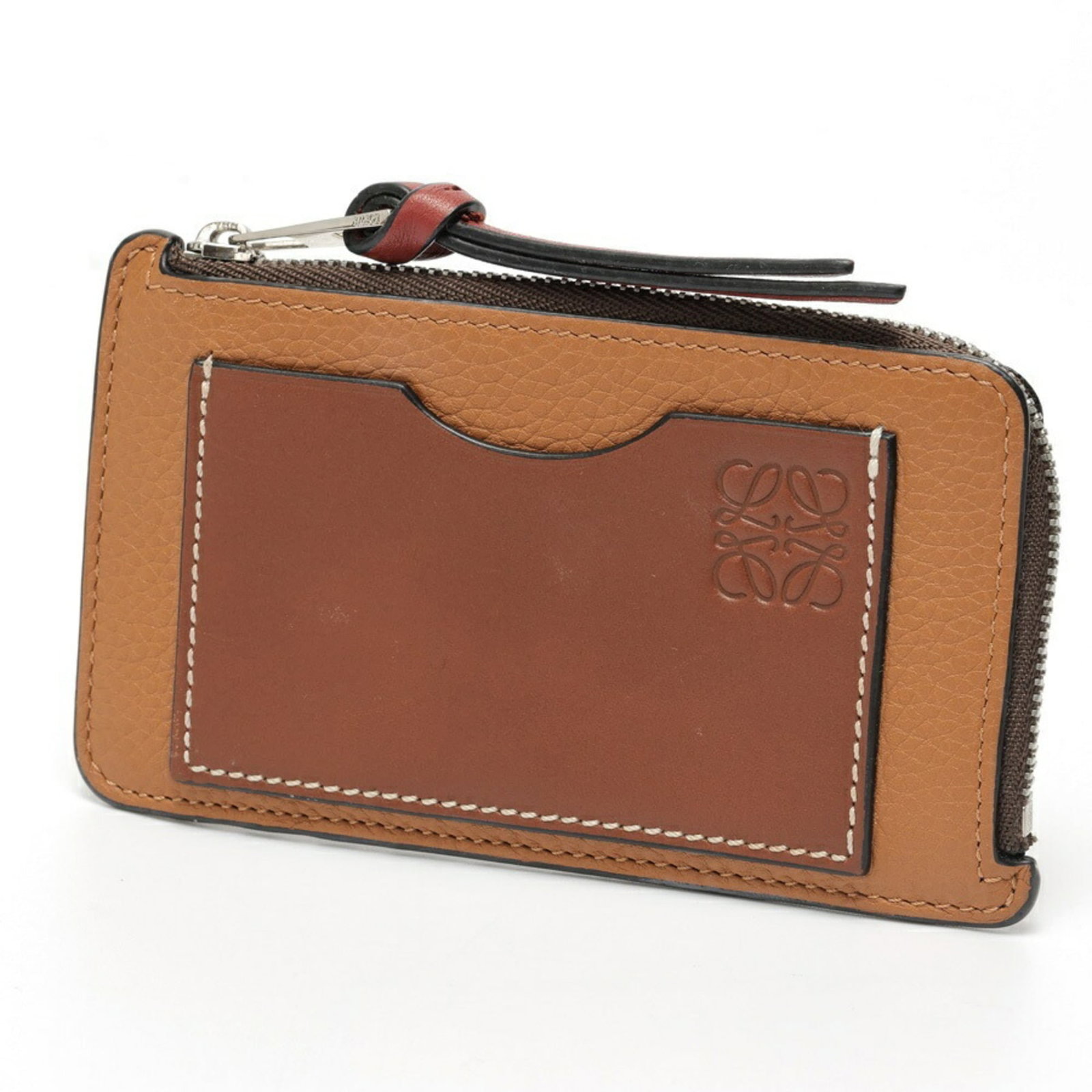 Loewe Card Case Leather: Loewe Card Case Leather Used Loewe Card Case Leather in camel color. The card case features high-quality leather material with traces of usage and minor scratches/dirt, giving it a worn-in look. Overa