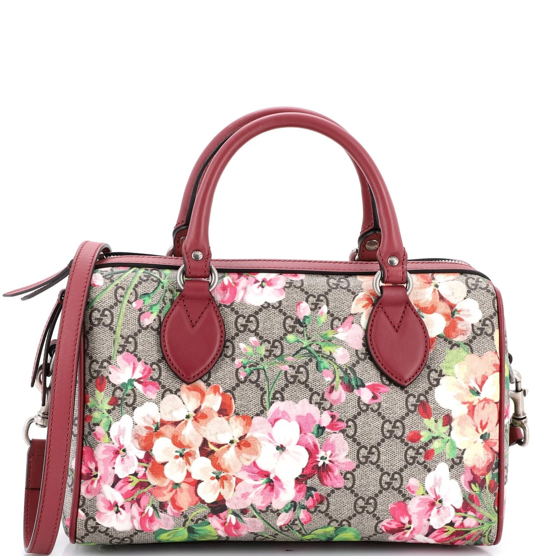 Gucci convertible bag blooms print canvas coating: Gucci convertible bag blooms print canvas coating The Gucci convertible bag boasts a vibrant blooms print canvas coating in pink, adding a pop of color to any outfit. With its top handle and convertib