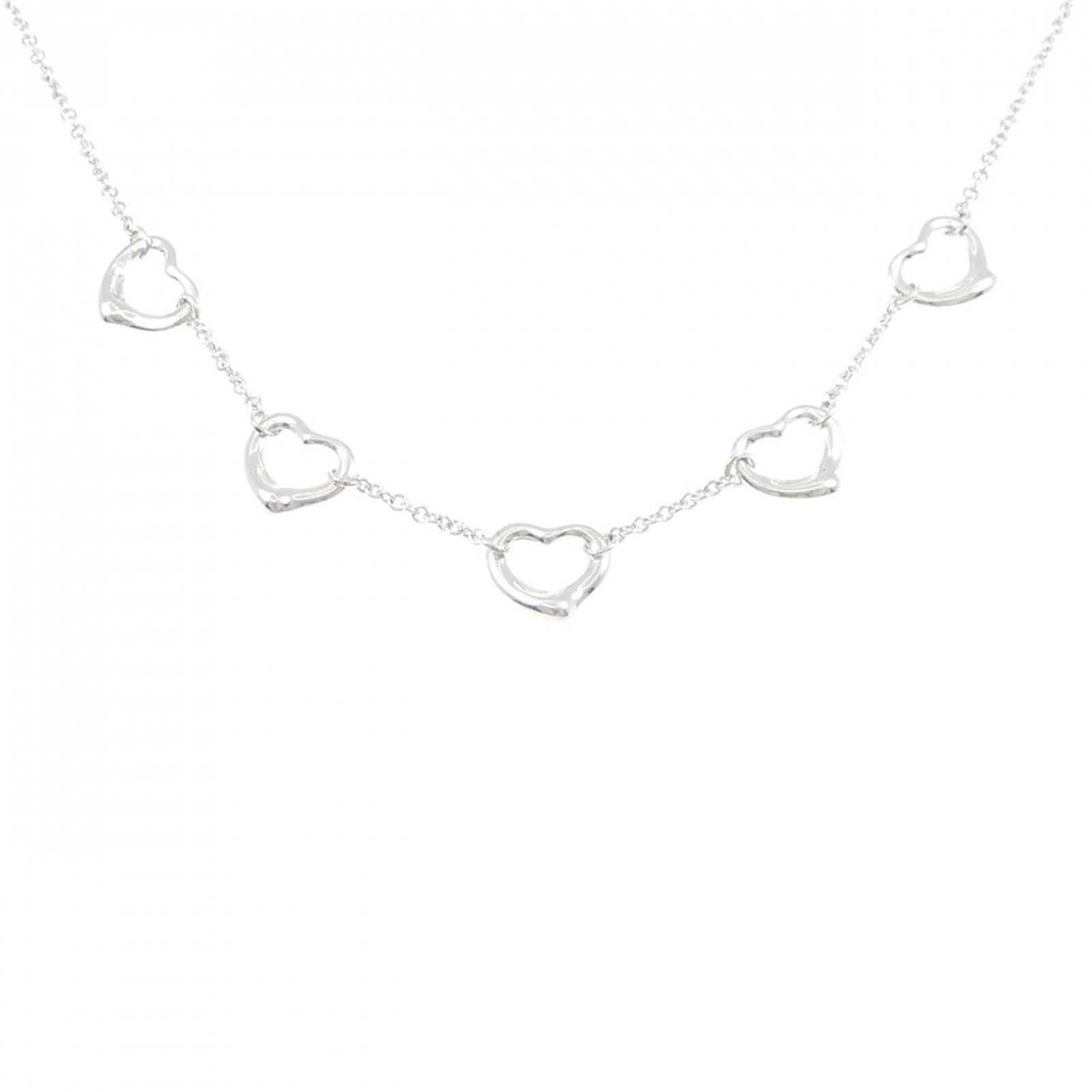 Tiffany Open Heart 5 Motif Necklace: Tiffany Open Heart 5 Motif Necklace The Tiffany Open Heart 5 Motif Necklace boasts an elegant design with intricate silverwork, featuring five motifs on its open heart-shaped pendant. With its spring
