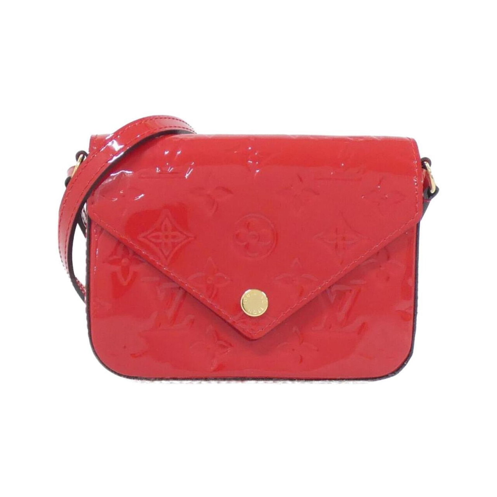 Louis Vuitton Shoulder Bag Leather: Louis Vuitton Shoulder Bag Leather Cerise red leather shoulder bag from Louis Vuitton features a classic design with enamel accents. The bag has some minor scratches and dirt, but remains in very good