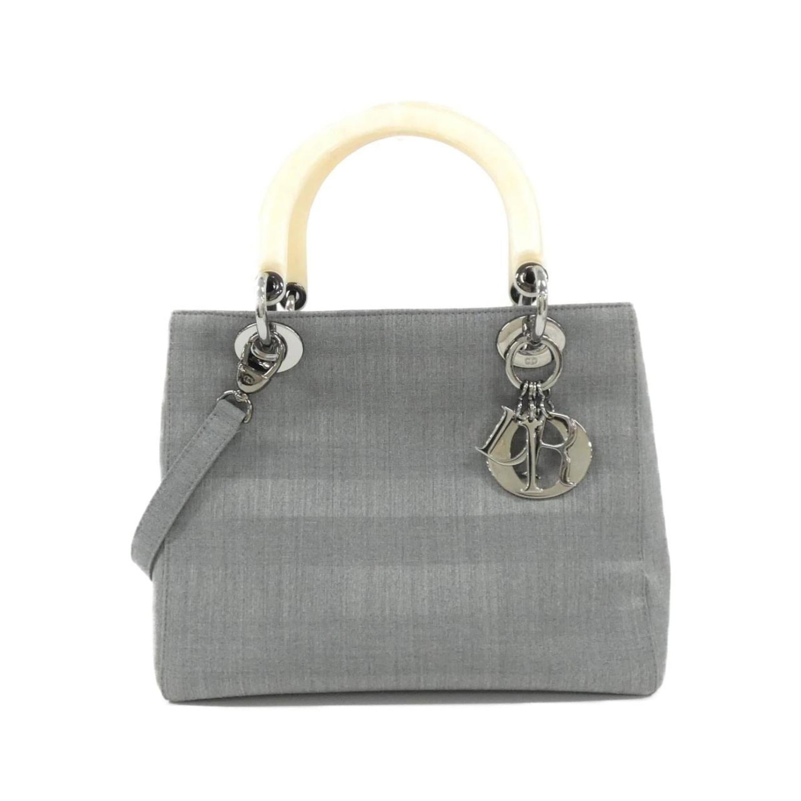 Christian Dior Handbag Canvas: Christian Dior Handbag Canvas Canvas Handbag from Christian Dior in Beige and Gray. This used handbag features a canvas material with some traces of usage, including scratches and dirt, yet remains in