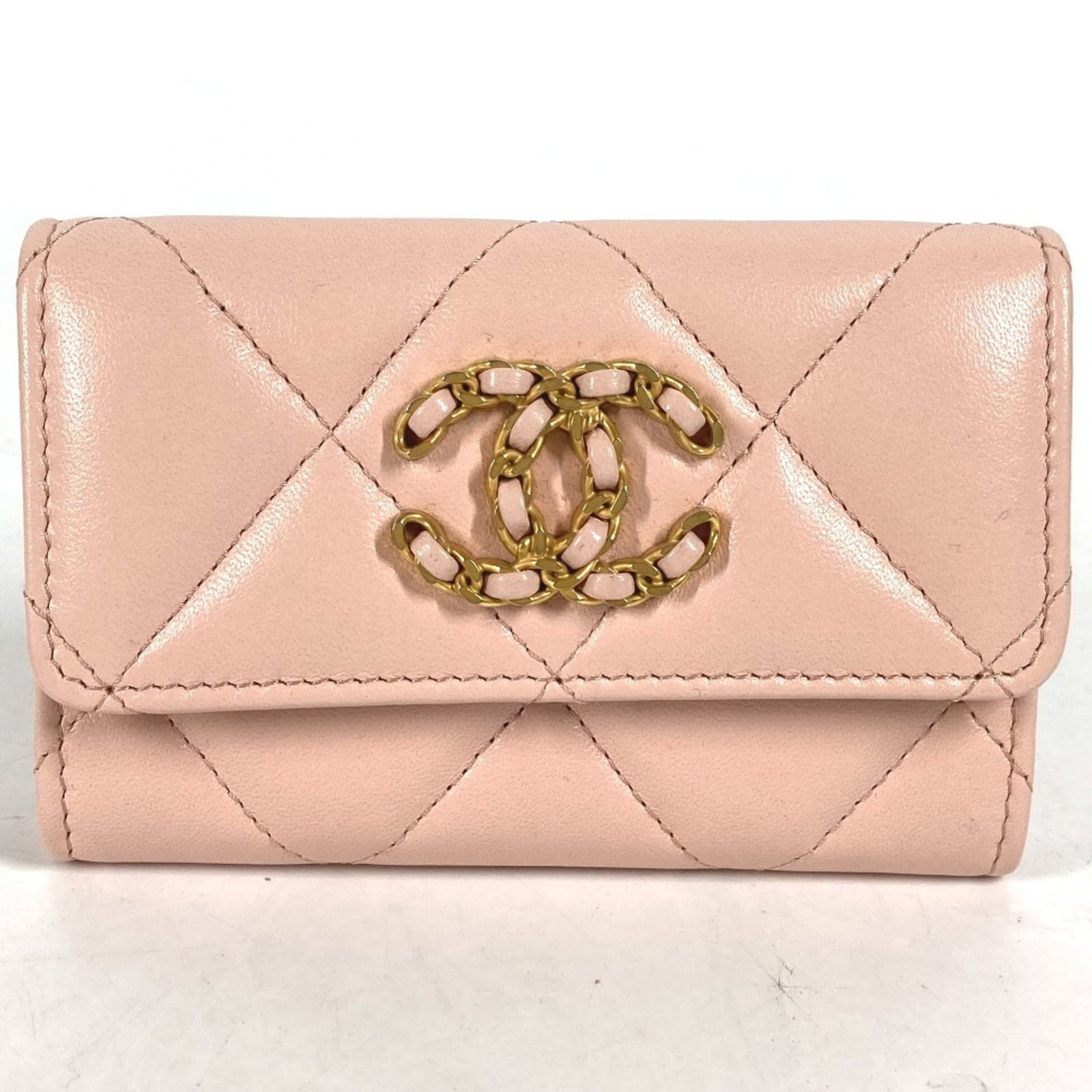 Chanel Coin Purse/Coin Case Leather: Chanel Coin Purse/Coin Case Leather Lambskin leather coin purse with gold and pink accents, measuring 7.5cm x 11cm, bearing a signature. This Chanel Coin Purse/Coin Case is made from high-quality lamb