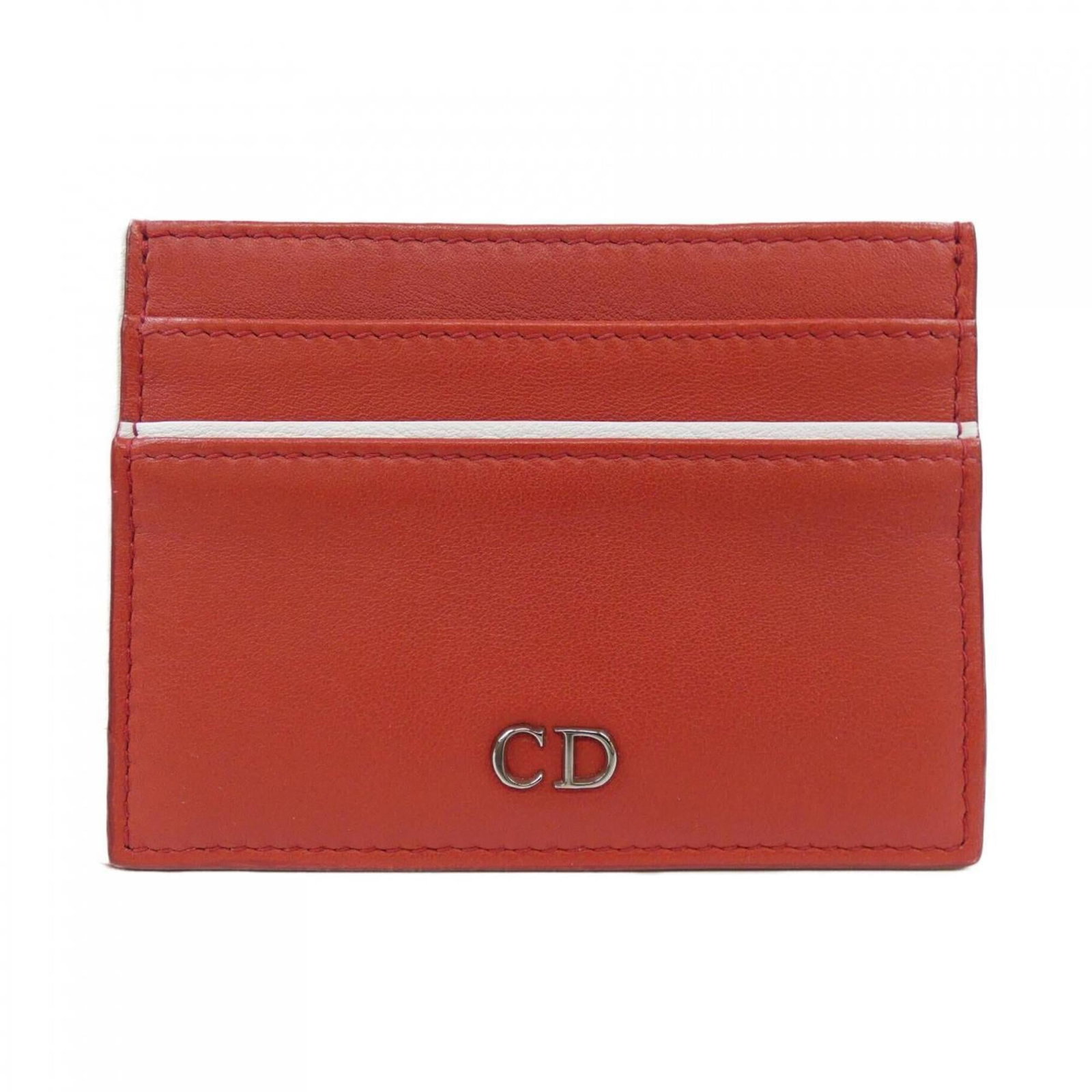 Christian Dior Business Card Case: Christian Dior Business Card Case This Christian Dior business card case features a bold red color and has been used, with traces of usage and minor damages visible. Despite showing signs of wear, it 