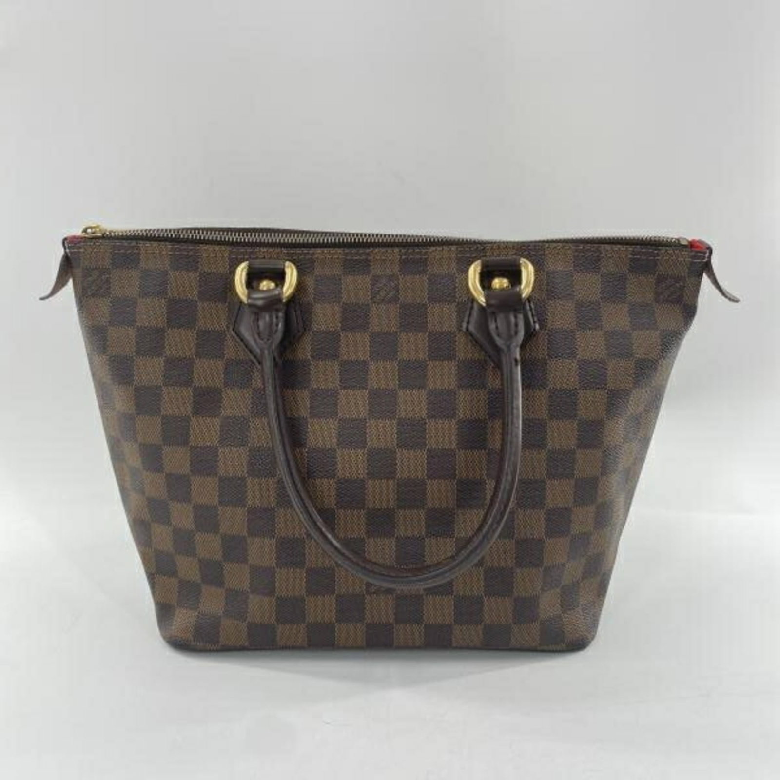 Louis Vuitton Handbag: Louis Vuitton Handbag Brown Louis Vuitton Handbag with Traces of Usage. This used handbag features a classic design and measures 24cm x 35cm x 14cm. With its brown color and 43cm handle length, this