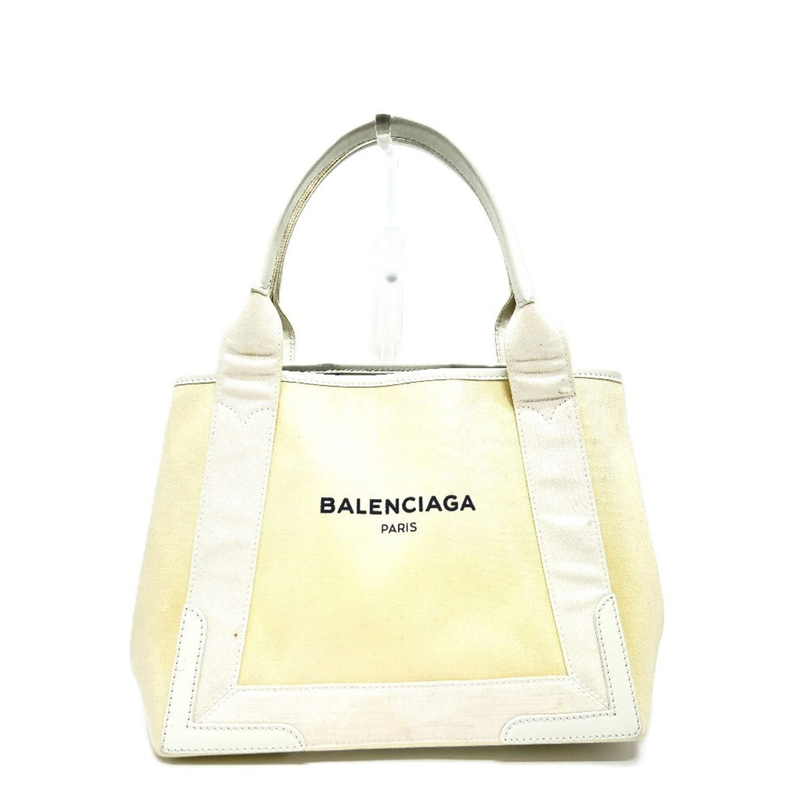 Balenciaga Handbag Tote Bag Canvas Leather: Balenciaga Handbag Tote Bag Canvas Leather Canvas and leather come together in this Balenciaga tote bag, featuring an open closure and classic design. Measuring 24cm x 29cm x 18cm, it has a sturdy han