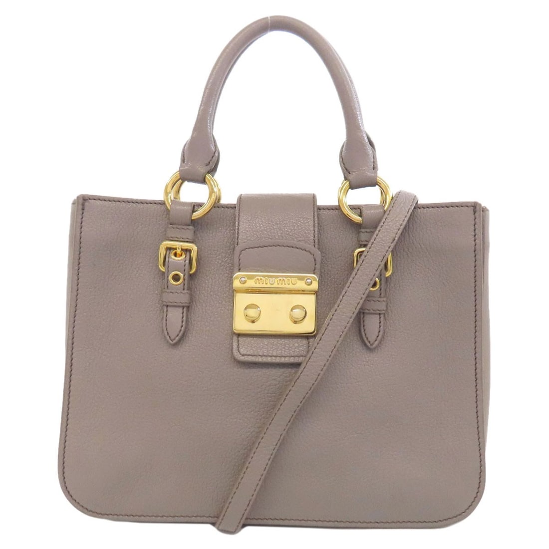 Handbag Leather Miumiu 2Way: Handbag Leather Miumiu 2Way The MIUMIU Handbag Leather 2Way in gray features a high-quality leather exterior. This stylish handbag boasts a distinctive 2-way design, making it a versatile and function
