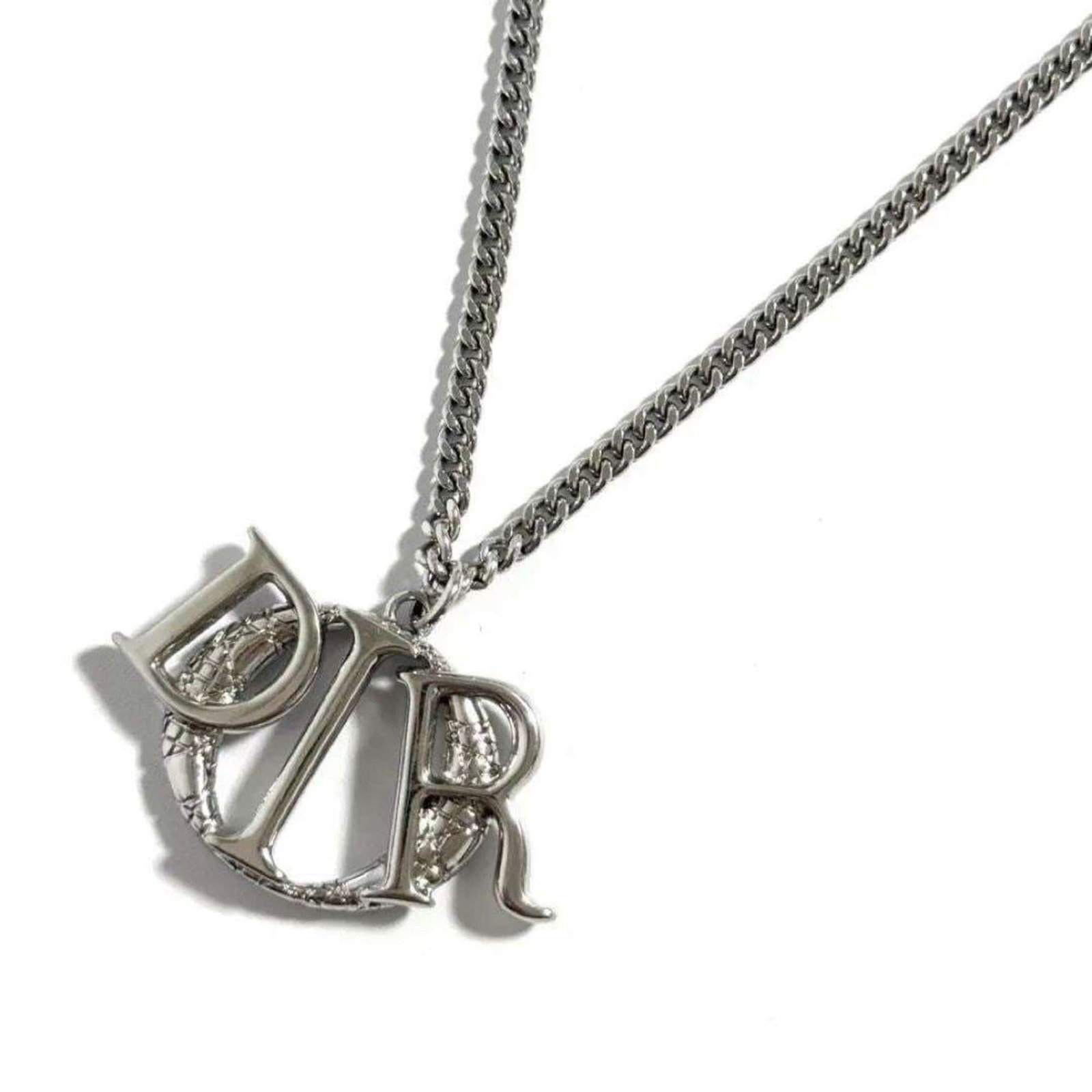 Christian Dior Dior Men'S Charm Pendant Necklace: Christian Dior Dior Men'S Charm Pendant Necklace The Christian Dior Dior Men's Charm Pendant Necklace boasts a sleek design with a pendant featuring the iconic Dior logo. Made from metal, this necklac