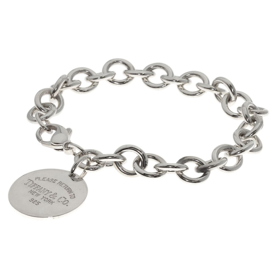 Return to Tiffany & Co Round Silver Bracelet: Return to Tiffany & Co Round Silver Bracelet Silver Round Bracelet from Tiffany & Co., featuring a sleek and modern design with no stone. Made from high-quality silver metal, this bracelet boasts a cl