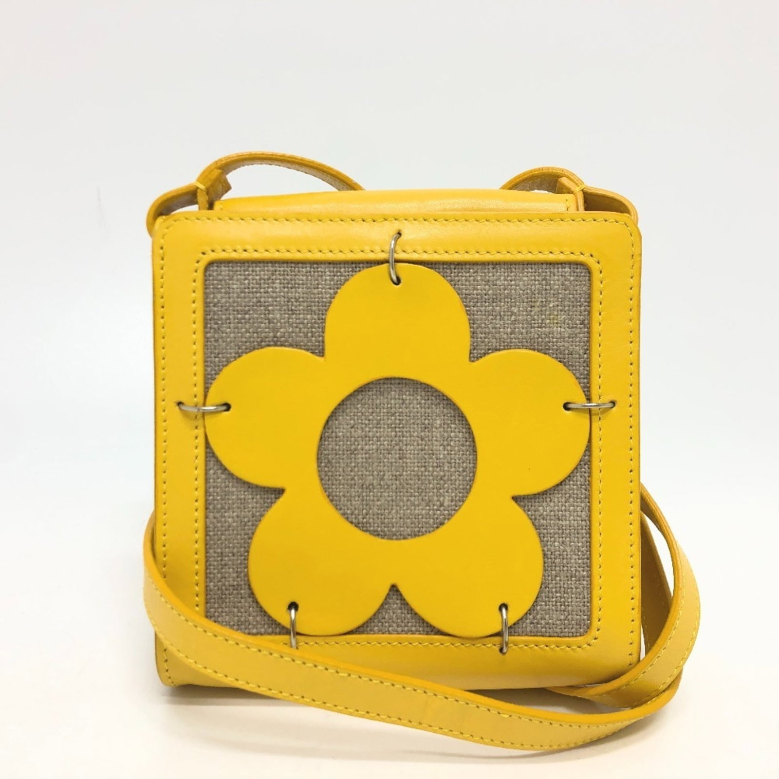 Celine Pochette Shoulder Bag Leather Canvas: Celine Pochette Shoulder Bag Leather Canvas The Celine Pochette Shoulder Bag Leather Canvas is a stylish and versatile accessory. This beige and yellow bag features a magnet closure and silver hardwar