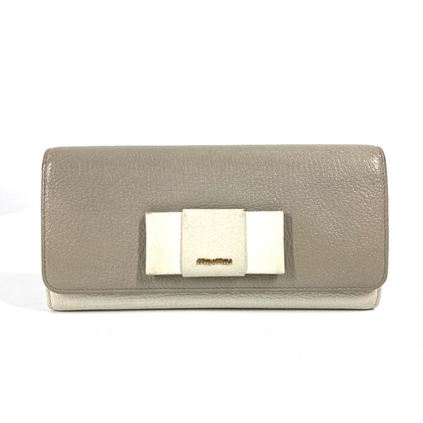 Miu Miu Long Wallet (Bi-Fold) Leather: Miu Miu Long Wallet (Bi-Fold) Leather The Miu Miu Long Wallet (Bi-Fold) Leather is a stylish and functional accessory. With its gray and white color combination, this bi-fold wallet features a classic