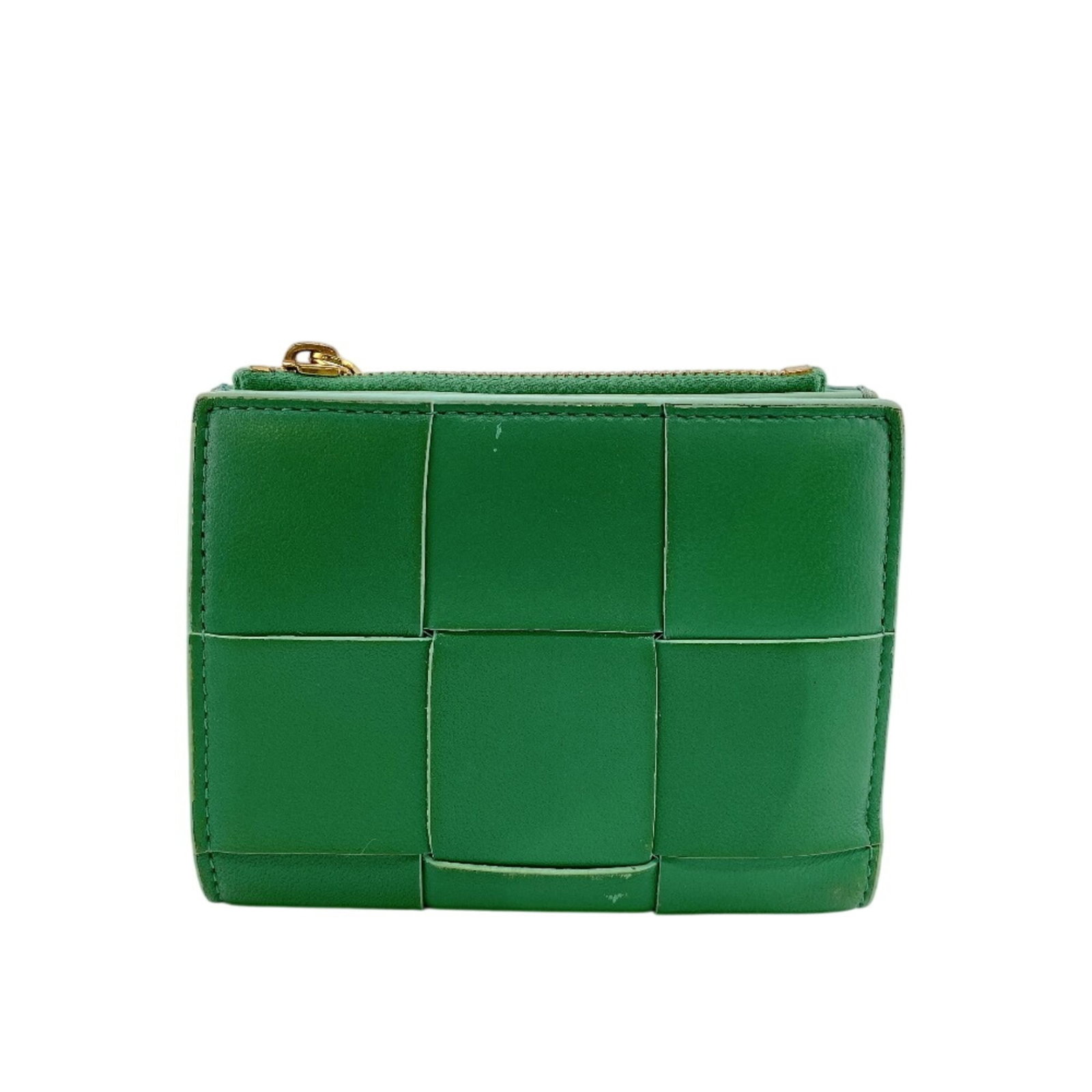Bottega Veneta Wallet (Bi-Fold) Leather: Bottega Veneta Wallet (Bi-Fold) Leather Bottega Veneta's iconic bi-fold wallet features a rich green leather exterior with subtle signs of wear. This pre-owned wallet boasts its classic design and tim
