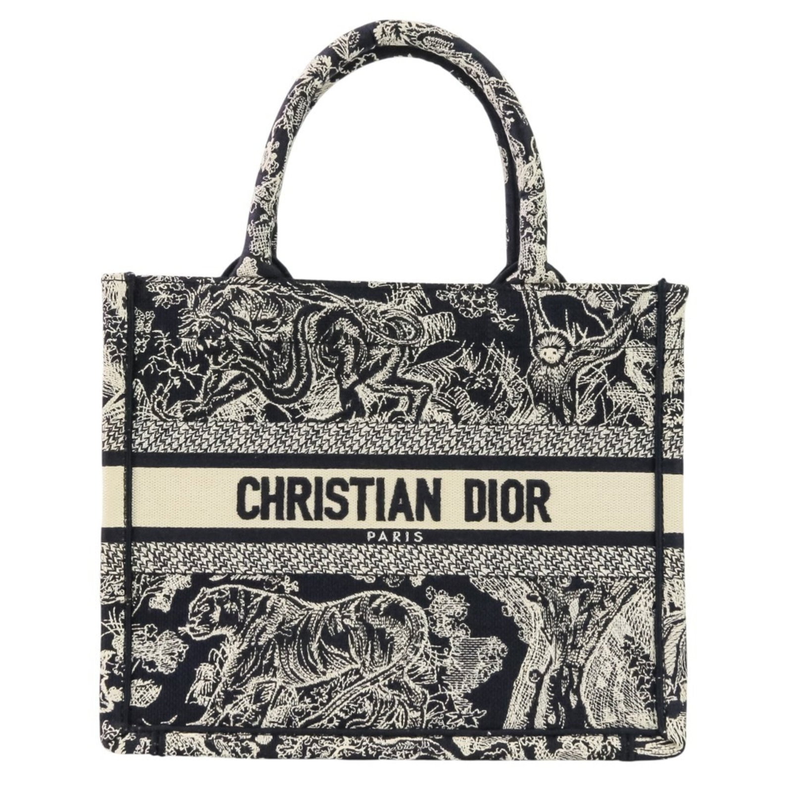 Christian Dior Handbag Canvas: Christian Dior Handbag Canvas Canvas Christian Dior Handbag in Navy. This navy canvas handbag features a classic design and measures 22.5cm x 27cm x 11cm. With its like-new condition and minimal signs