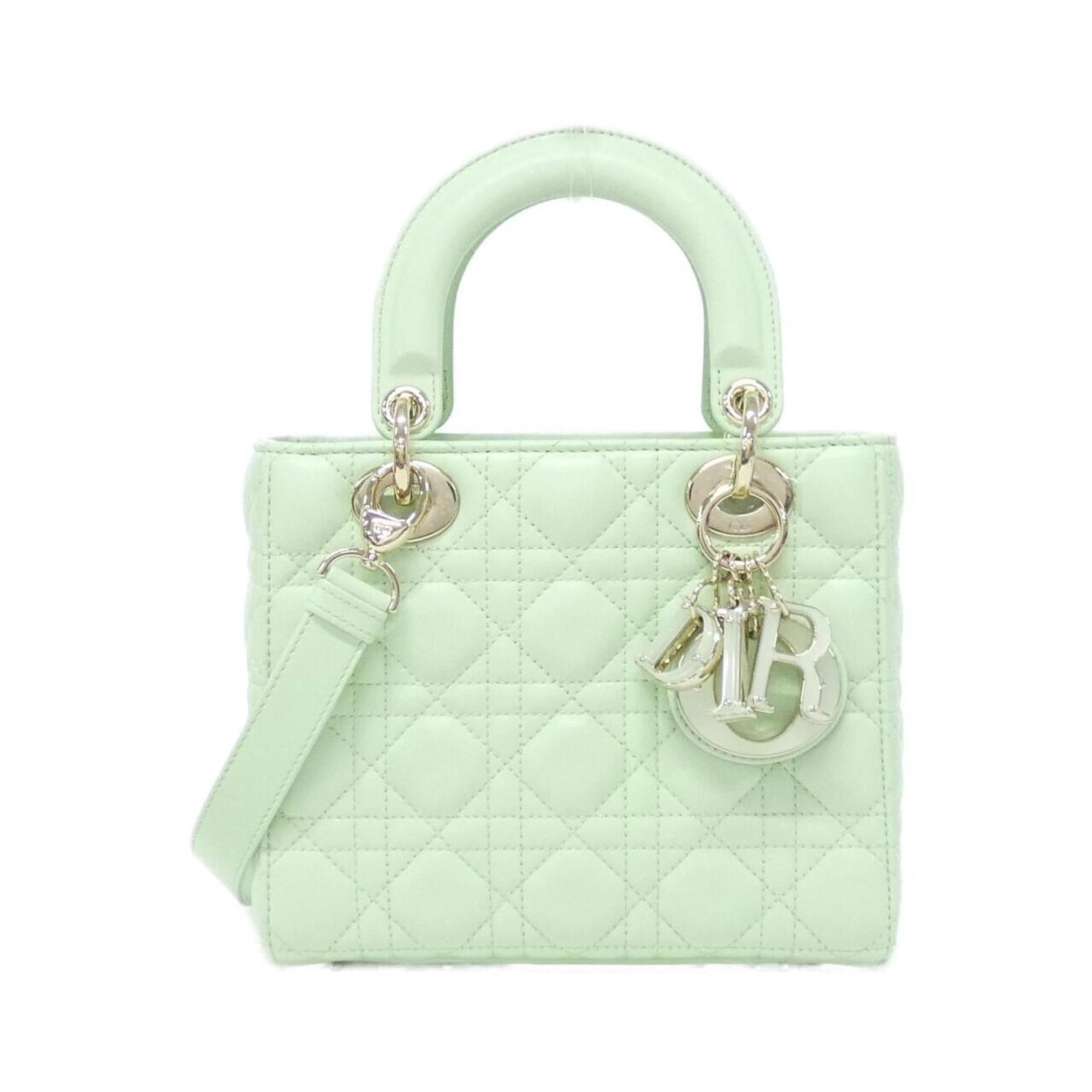 Christian Dior Shoulder Bag Leather: Christian Dior Shoulder Bag Leather Light green lambskin Christian Dior shoulder bag with a classic design and subtle scratches from occasional use. This pre-owned bag features high-quality leather co