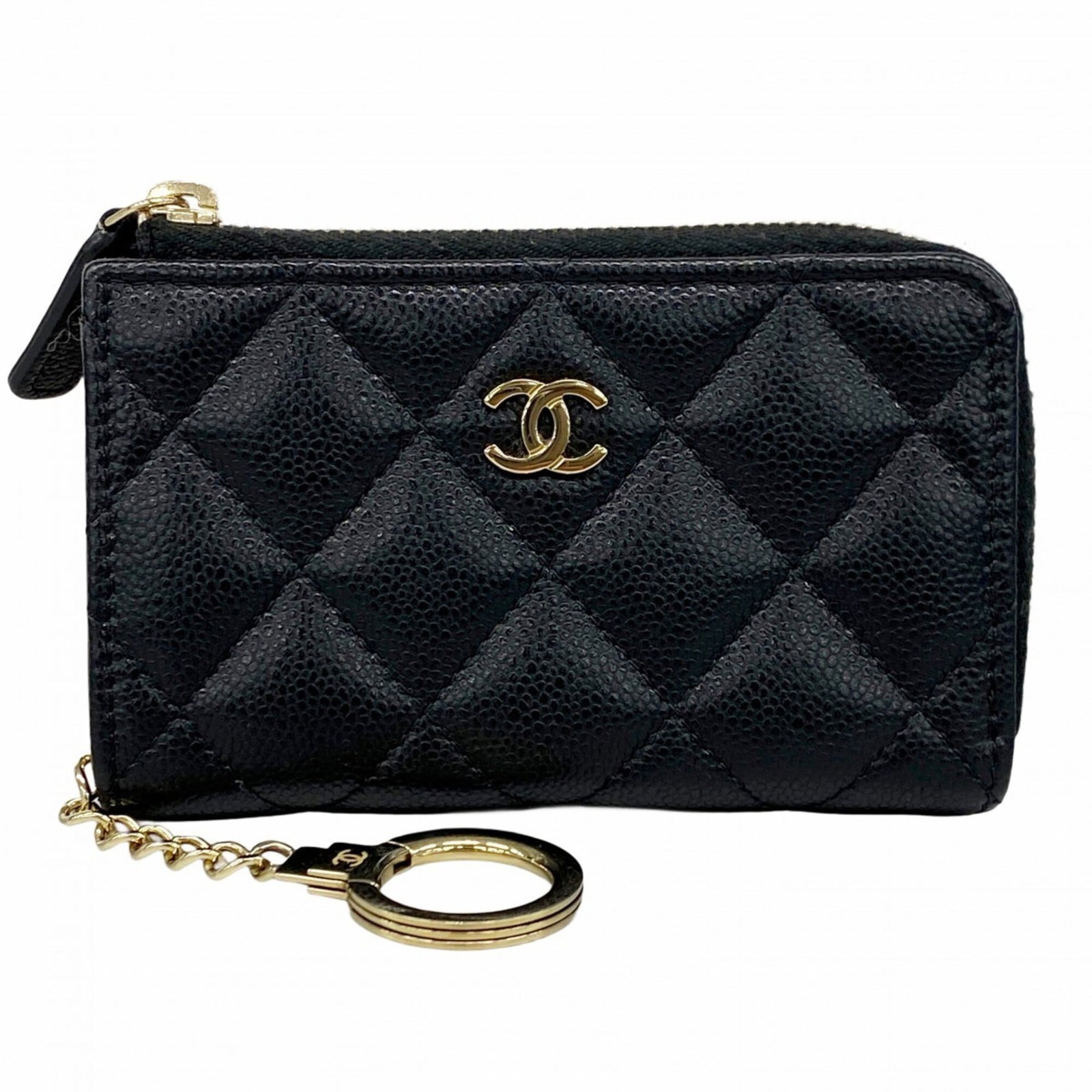 Chanel Coin Purse/Coin Case Grained Calfskin: Chanel Coin Purse/Coin Case Grained Calfskin This Chanel Coin Purse/Coin Case in grained calfskin features a sleek and sophisticated design. Made from high-quality black leather with a subtle texture,