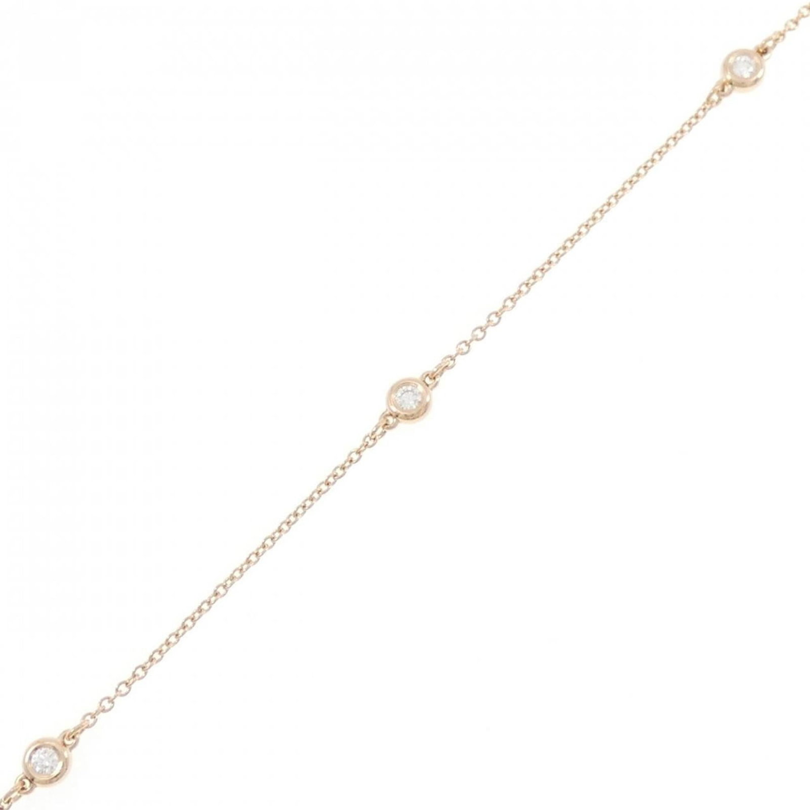 Tiffany Charm Bracelet Pink Gold: Tiffany Charm Bracelet Pink Gold Tiffany's Pink Gold Charm Bracelet boasts a delicate design with a few traces of usage, showcasing subtle scratches and dirt. Made from high-quality pink gold, this 18