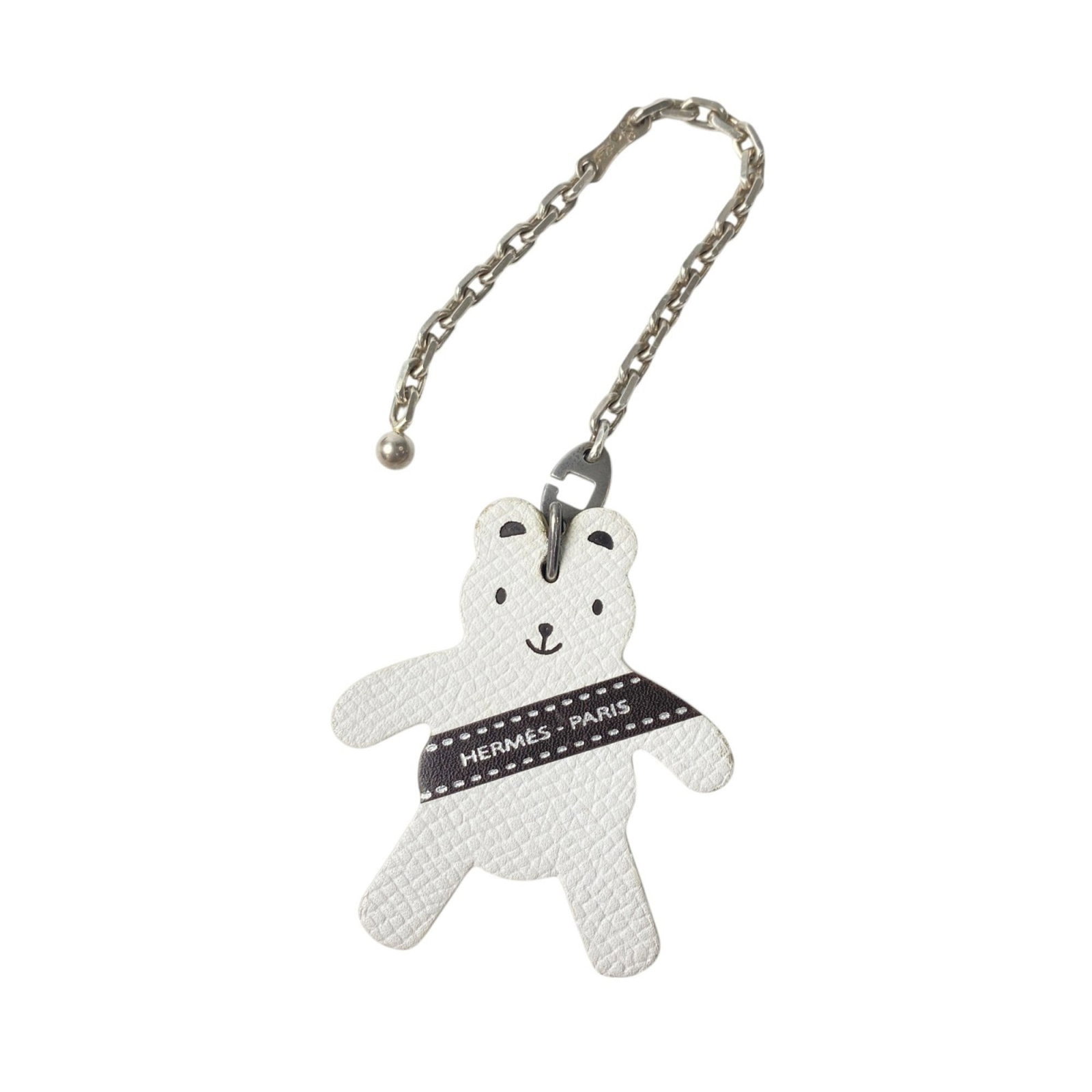 Hermes Handbag Charm Epsom Leather: Hermes Handbag Charm Epsom Leather Epsom leather handbag charm from Hermes features a classic design with brown and white color options. The charm measures 55mm x 50mm in size and has visible traces o