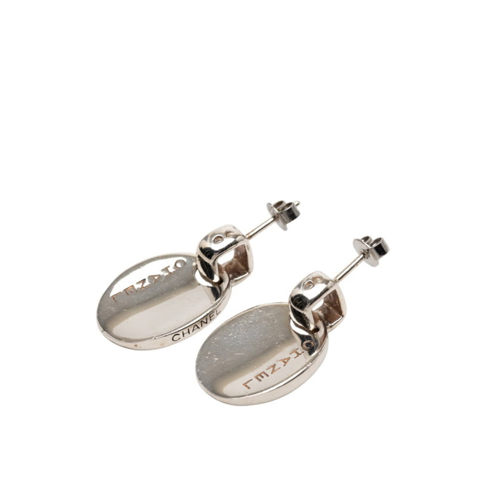 Chanel Stud Earrings Silver 925: Chanel Stud Earrings Silver 925 Stud earrings from Chanel's iconic collection, crafted in sterling silver 925. With a subtle shine and elegant design, these earrings feature a classic style that suits