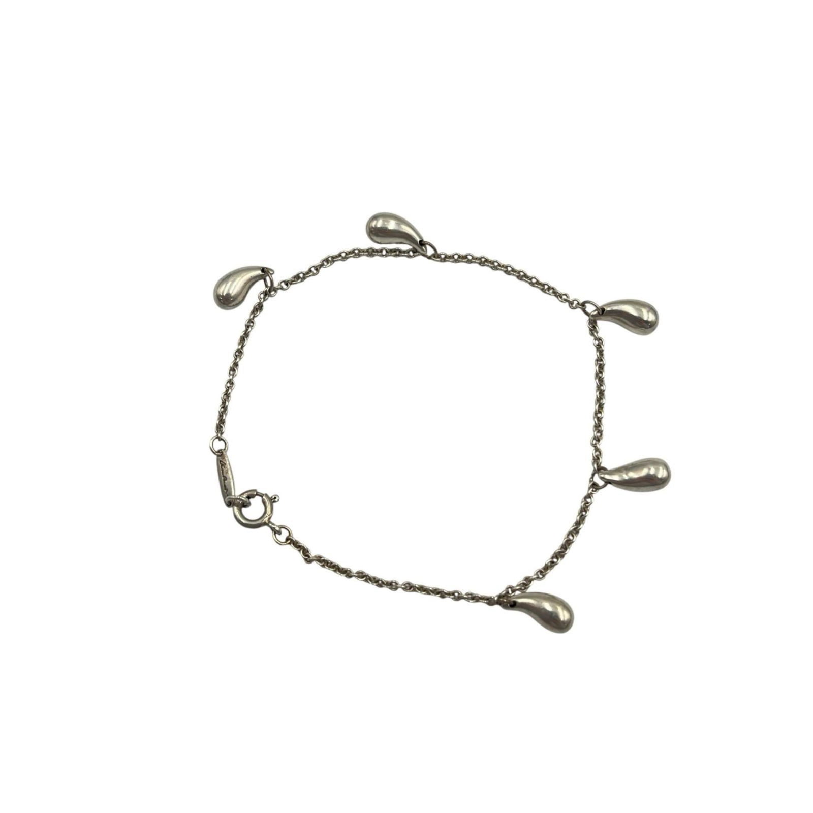 Tiffany Charm Bracelet Silver 925: Tiffany Charm Bracelet Silver 925 Made from high-quality Silver 925, this Tiffany charm bracelet boasts a sleek and classic design. With its silver finish and durable construction, it's a timeless acc