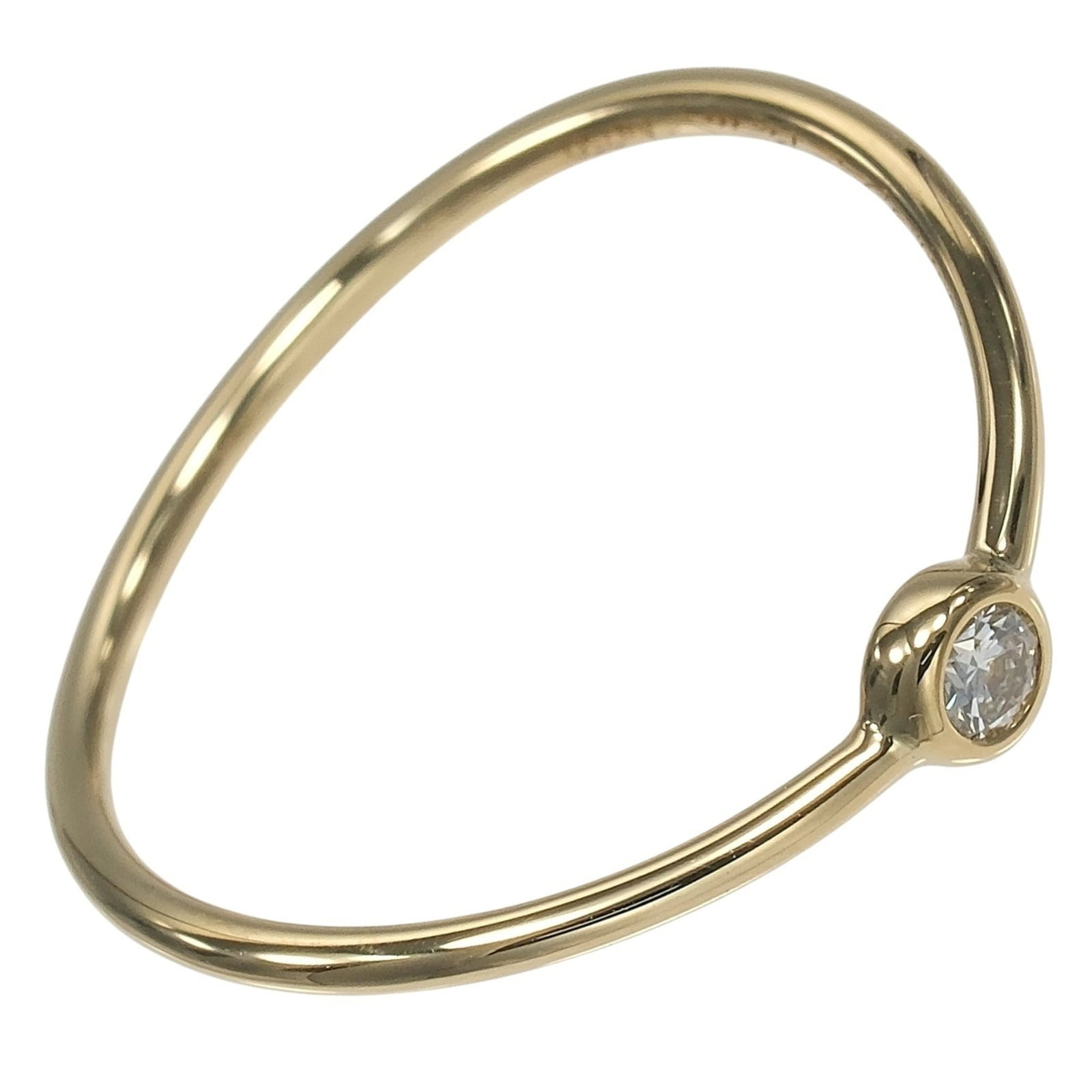 Tiffany Band Ring Yellow Gold (18K): Tiffany Band Ring Yellow Gold (18K) Tiffany's iconic yellow gold band ring boasts a delicate design and subtle elegance. Featuring a diamond stone set in 18K yellow gold, this classic piece showcases 