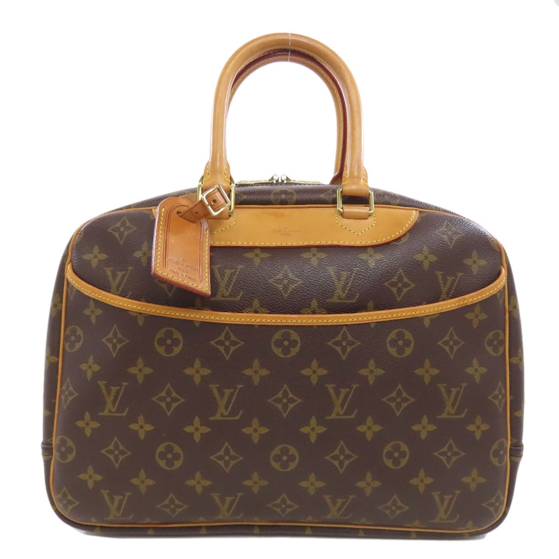 Monogram Canvas Louis Vuitton M47270 Deauville Boston Bag: Monogram Canvas Louis Vuitton M47270 Deauville Boston Bag Monogram canvas exterior adds a touch of timeless elegance to this classic Louis Vuitton Boston bag. The iconic design features a distinctive 