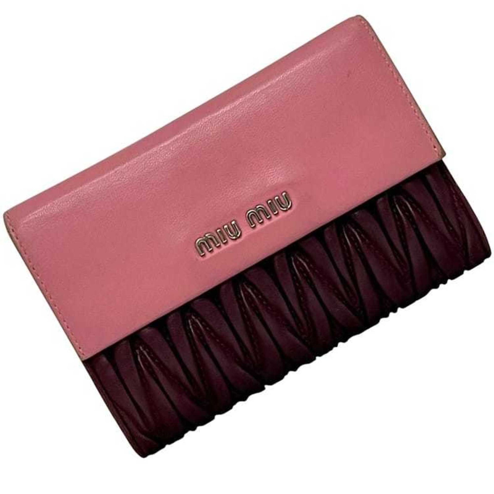 Miu Miu Wallet (Tri-Fold) Leather: Miu Miu Wallet (Tri-Fold) Leather The Miu Miu Tri-Fold Wallet in Bordeaux features a classic design with a rich leather finish. This used wallet has some minor signs of wear, including scratches and