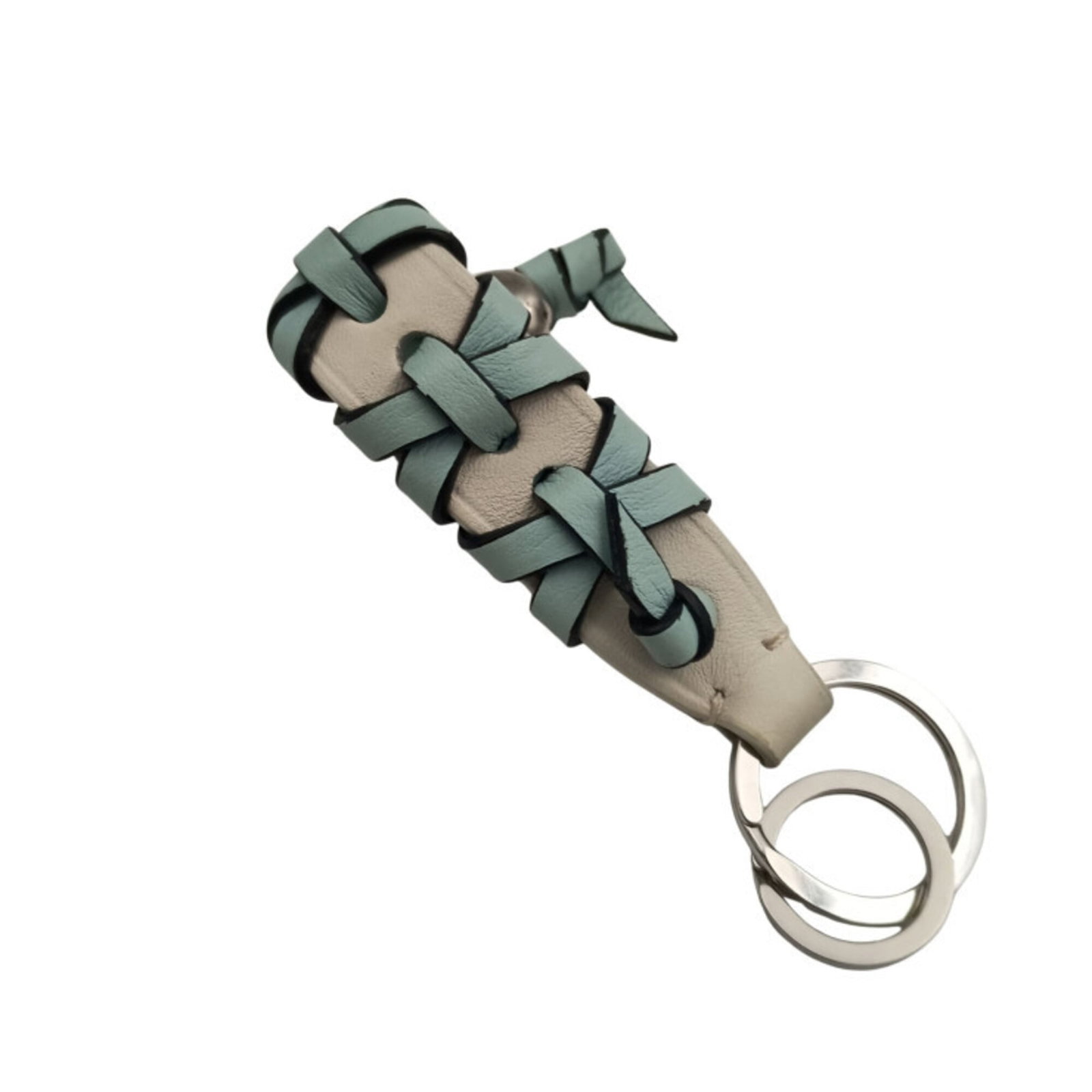 Loewe Keyring Leather: Loewe Keyring Leather Light blue and white Loewe leather keyring in good condition, with traces of usage visible. The leather has scratches and dirt, but remains generally intact. A used accessory fro
