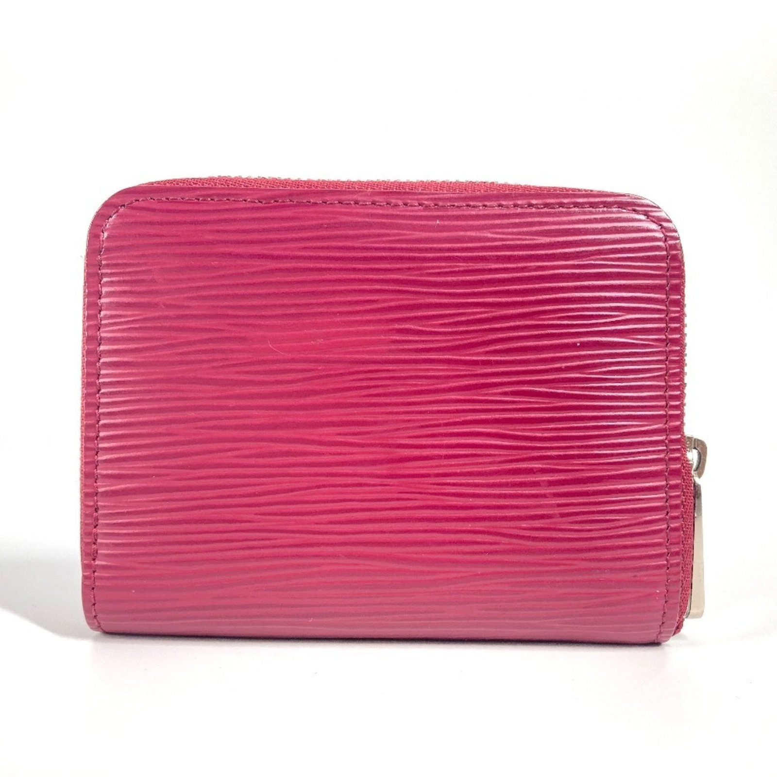 Louis Vuitton Coin Purse/Coin Case Epi Leather: Louis Vuitton Coin Purse/Coin Case Epi Leather The Louis Vuitton Coin Purse/Coin Case Epi Leather in Fuchsia Pink features the iconic brand's signature style with its distinctive monogram pattern and