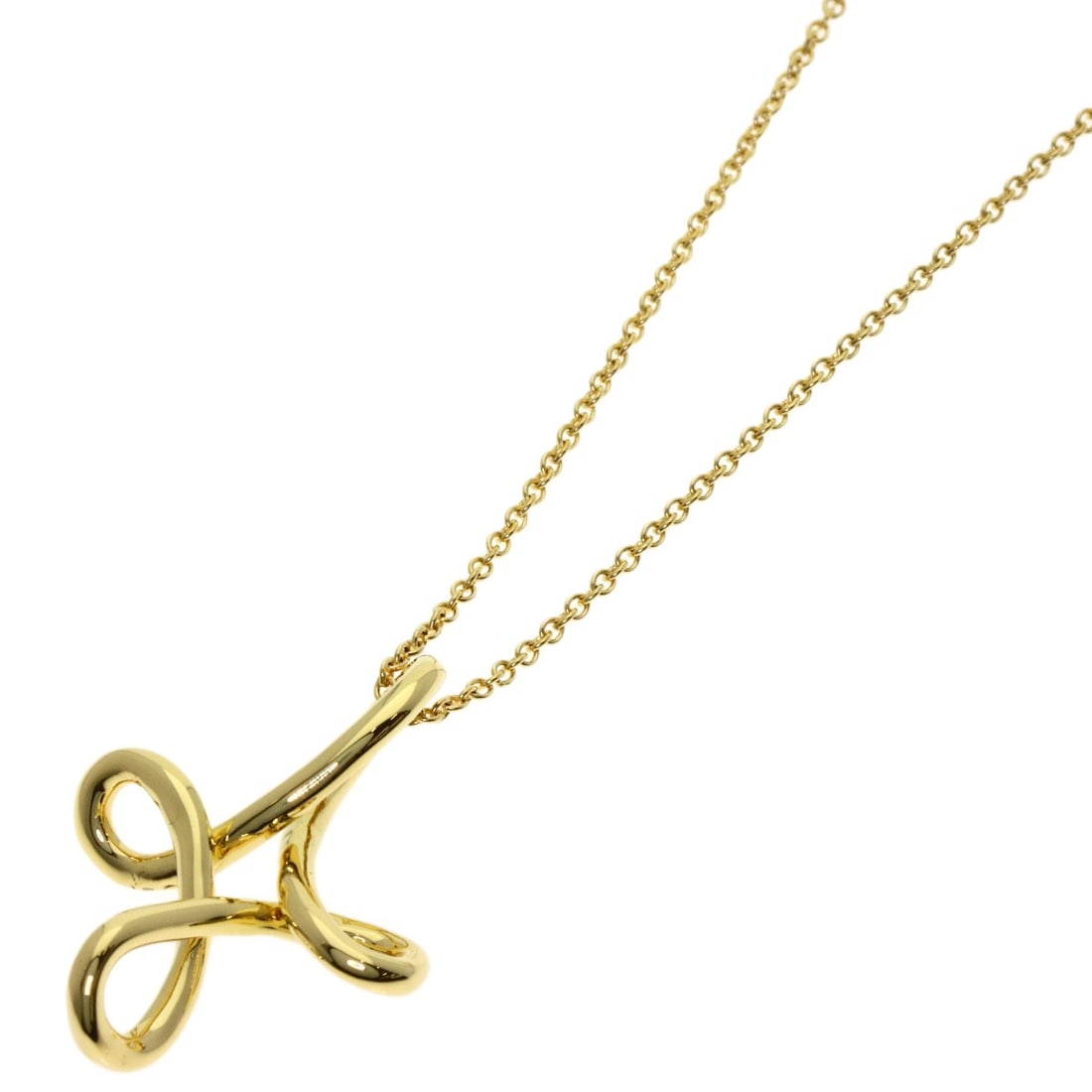 Tiffany&Co Yellow Gold Necklace K18 Cross Open: Tiffany&Co Yellow Gold Necklace K18 Cross Open K18 Yellow Gold Necklace with a sleek design, this Tiffany&Co. piece features a cross motif in high-quality gold metal, measuring 15.9 inches in length. 