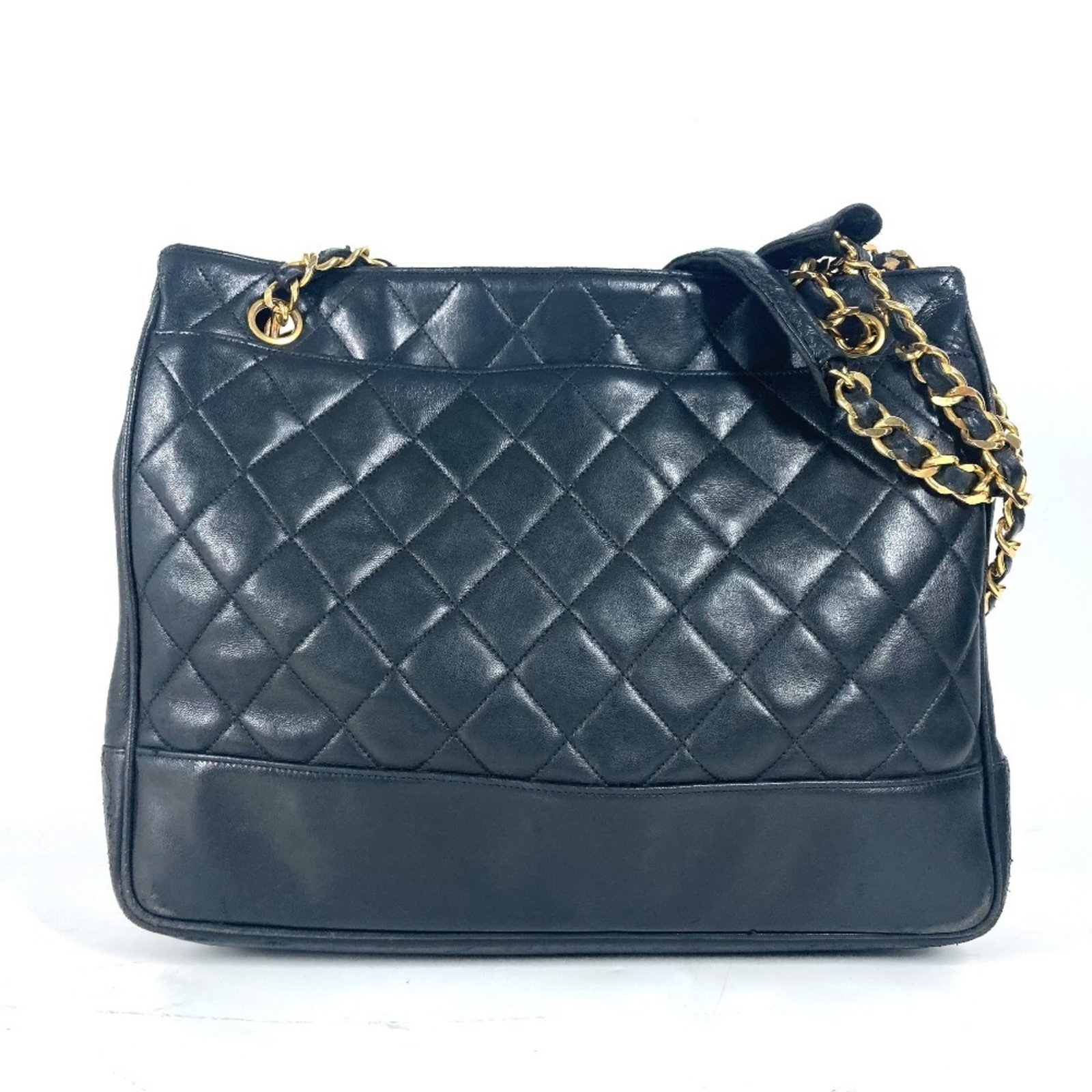 Chanel Shoulder Bag Tote Bag Leather: Chanel Shoulder Bag Tote Bag Leather This luxurious Chanel shoulder bag tote features rich black lambskin leather and gold accents, showcasing the iconic brand's timeless elegance. With its classic de