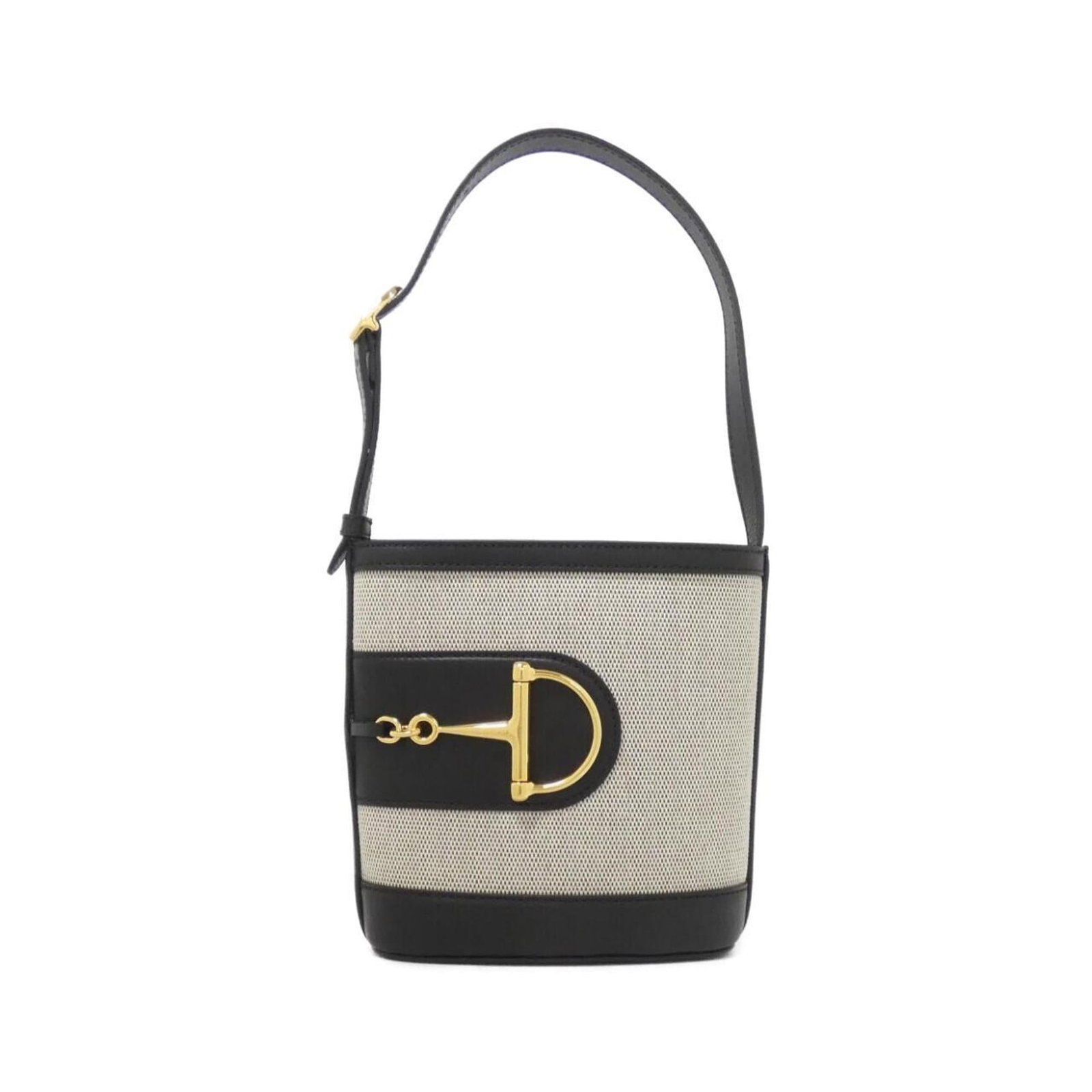 Gucci Handbag Canvas Leather: Gucci Handbag Canvas Leather Canvas and leather Gucci handbag in black with gold hardware. The bag has some scratches and dirt from usage, but remains in very good condition overall. It measures 19cm