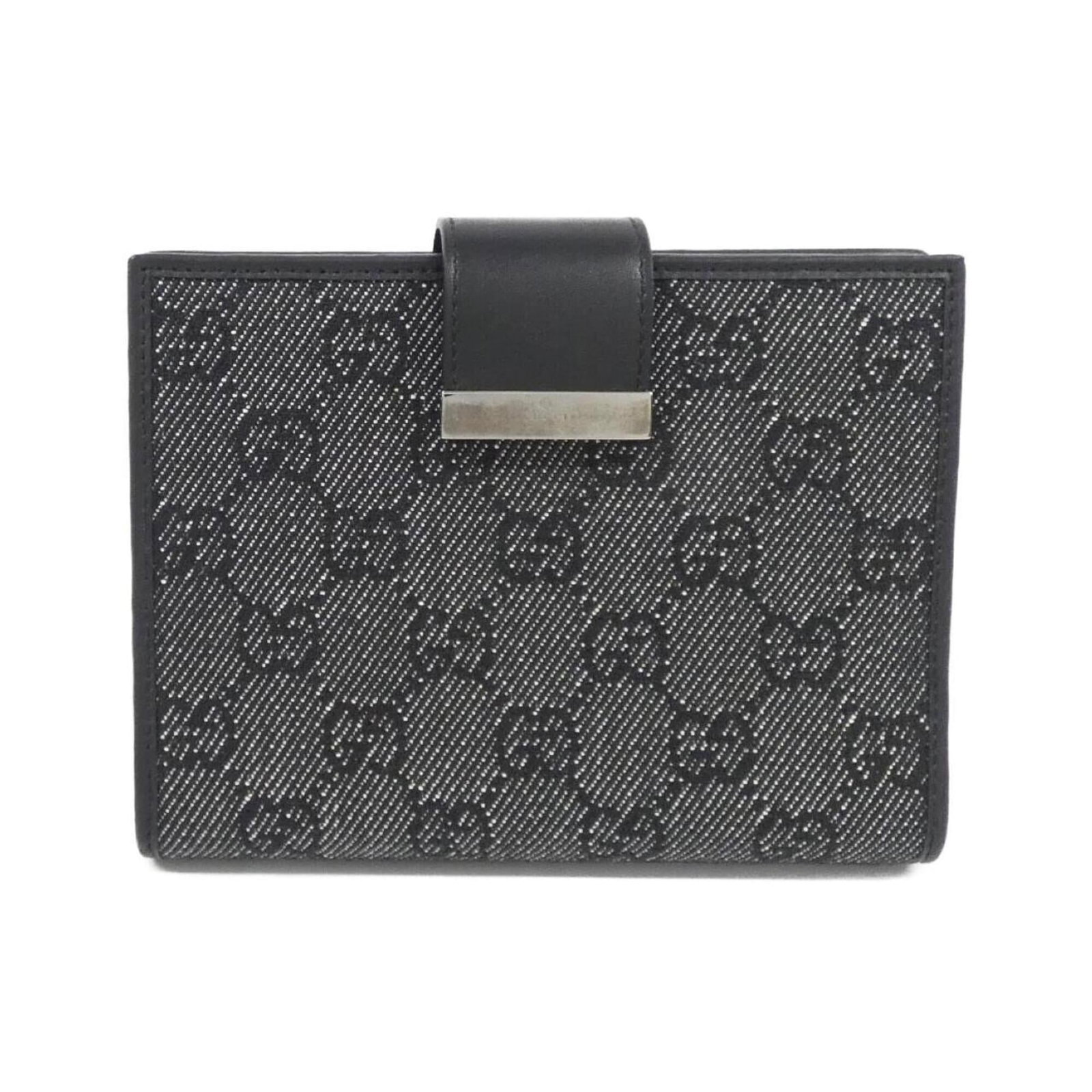 Gucci 74259 Organizer: Gucci 74259 Organizer This Gucci organizer features a classic black denim design with a few traces of usage, some scratches and dirt visible. Despite its worn appearance, the item remains in very good