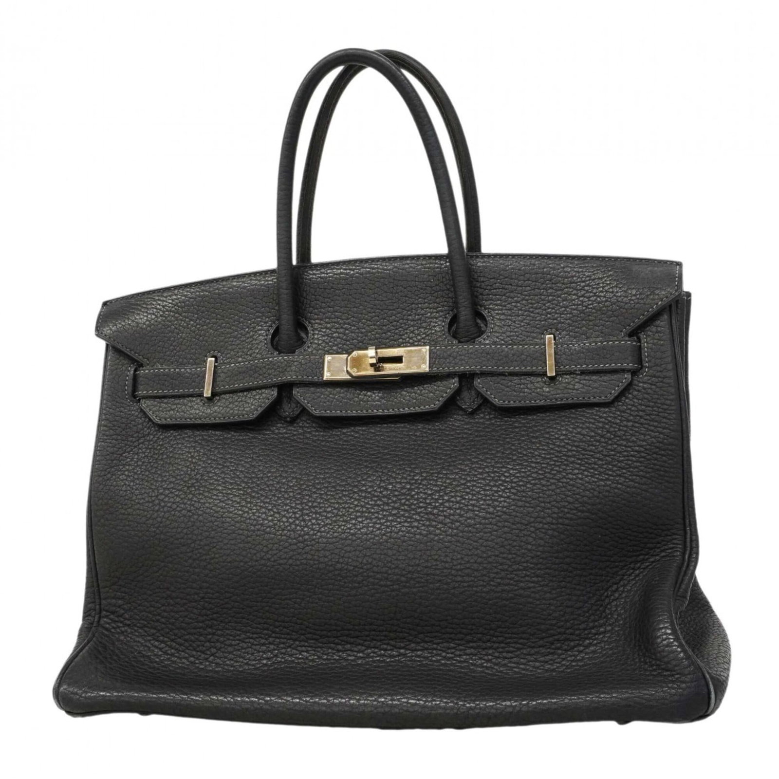 Hermes Handbag Togo Leather: Hermes Handbag Togo Leather Togo leather craftsmanship shines in this pre-owned Hermes handbag, featuring a striking blue indigo hue and sleek silver hardware. The bag's condition reflects its age, wi