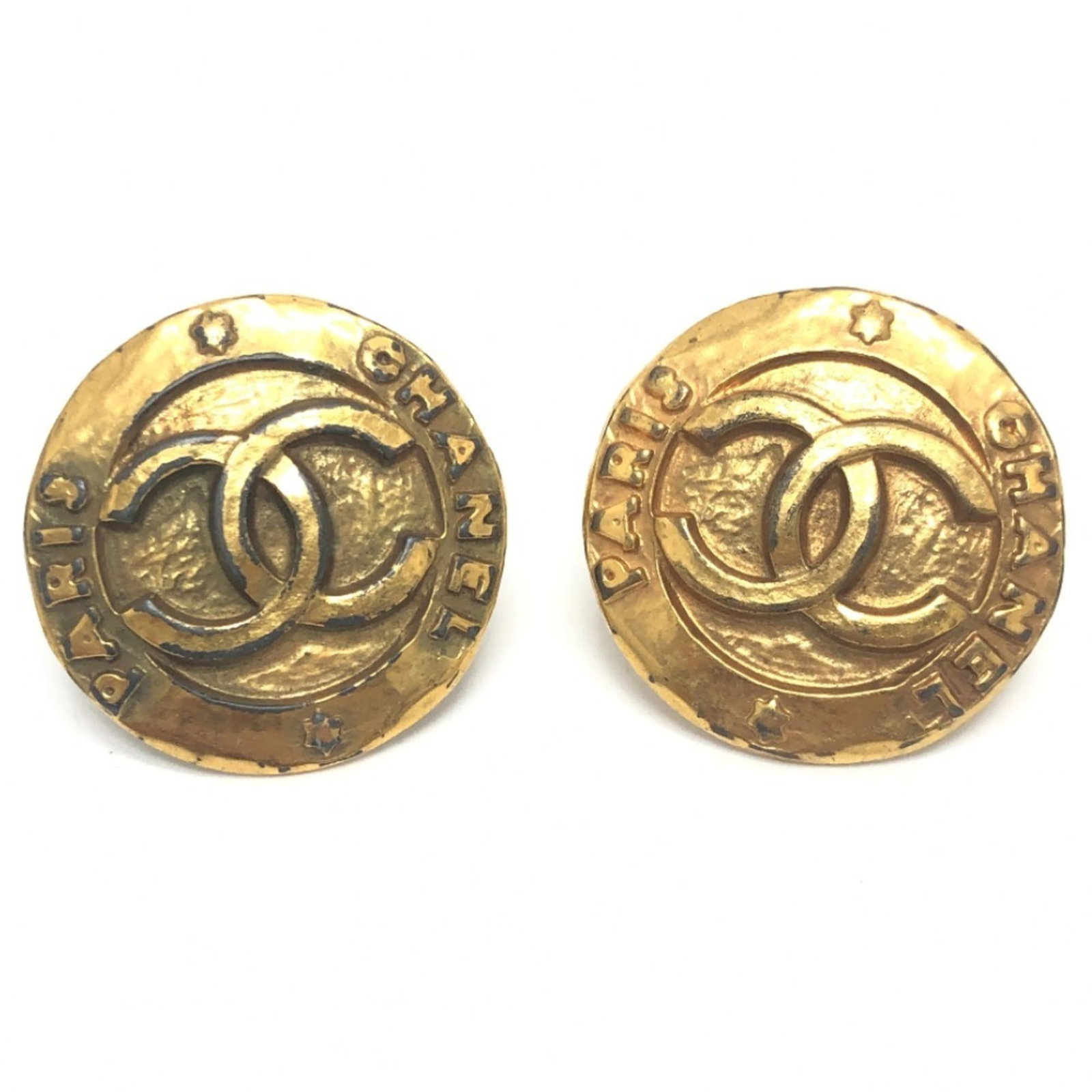 Chanel Clip Earrings Metal: Chanel Clip Earrings Metal Chanel's iconic clip earrings are a timeless accessory for women. Made from metal and available in gold, these classic earrings feature a sleek design that complements any o