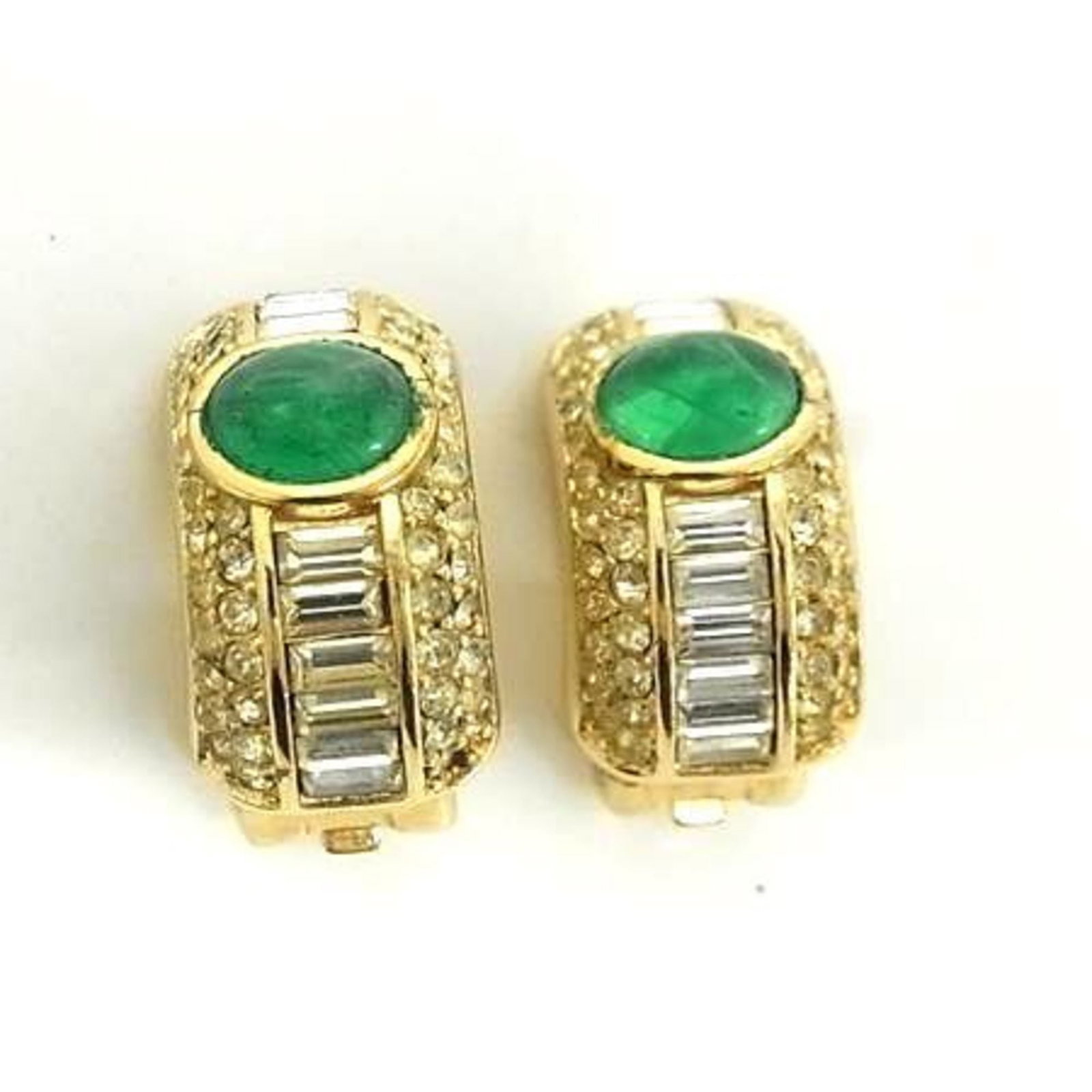 Christian Dior Clip Earrings Metal Rhinestone: Christian Dior Clip Earrings Metal Rhinestone Gold and green rhinestones adorn these sleek clip earrings from Christian Dior, adding a touch of luxury to any outfit. With their metallic construction a
