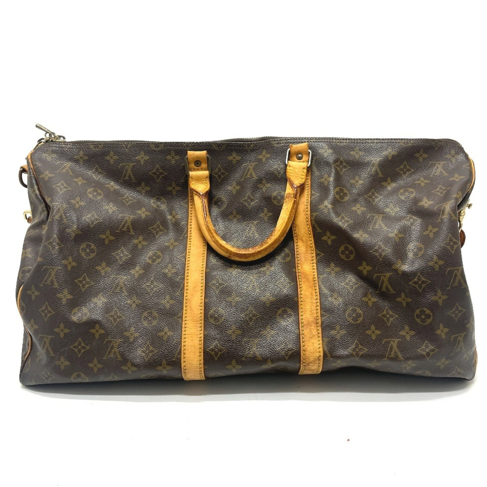 Louis Vuitton Boston Bag Monogram: Louis Vuitton Boston Bag Monogram The Louis Vuitton Boston Bag Monogram boasts its iconic monogram pattern in rich brown, adding a touch of timeless elegance to any outfit. With a sturdy size and clas