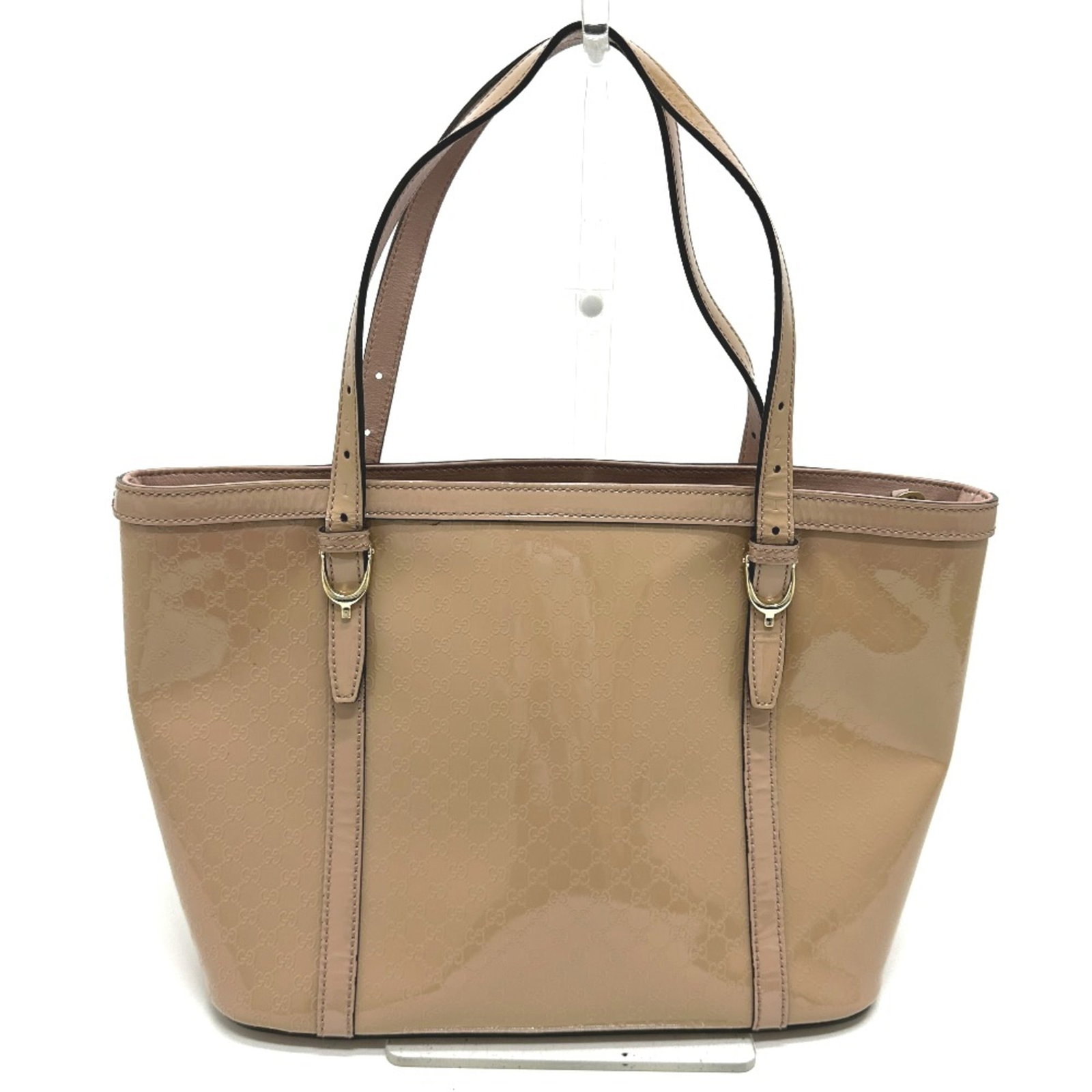 Gucci Tote Bag Patent Leather: Gucci Tote Bag Patent Leather Gucci's iconic tote bag boasts a striking patent leather finish in beige, adding an air of sophistication to any outfit. Measuring 29cm x 21cm x 13cm, this spacious bag