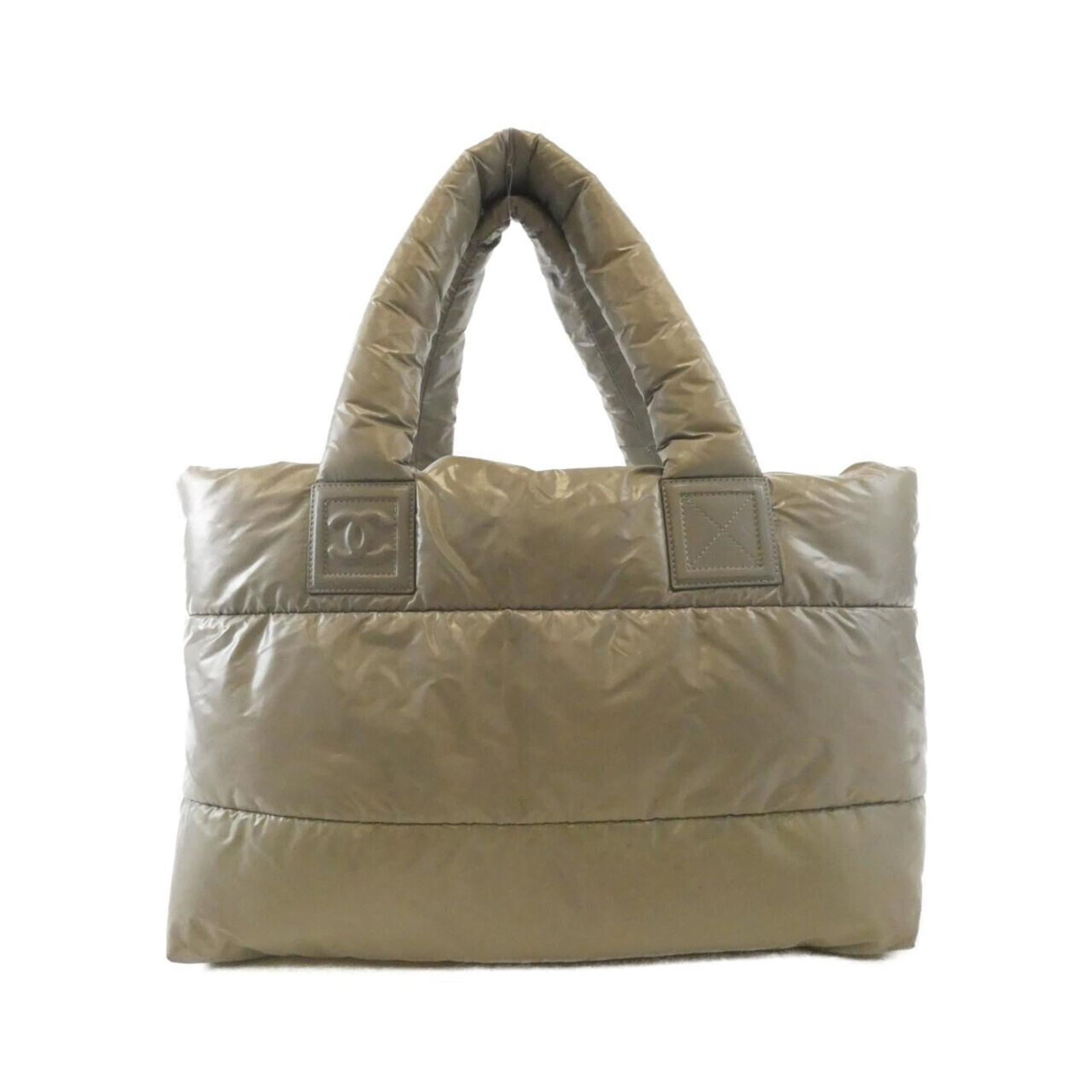 Chanel Handbag Nylon: Chanel Handbag Nylon This Chanel Handbag Nylon features a unique khaki color and classic design. With its durable nylon material and timeless style, this bag remains a stylish accessory for everyday u