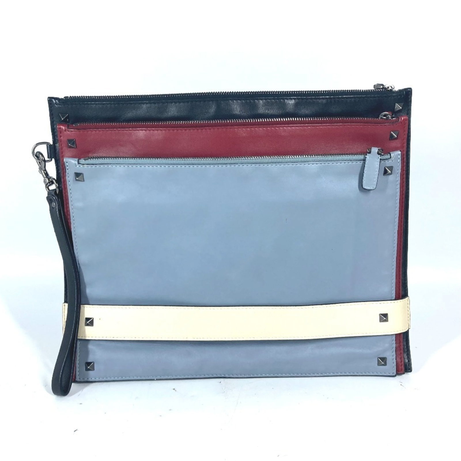 Valentino Clutch Bag Leather: Valentino Clutch Bag Leather Valentino's iconic leather clutch bag boasts sleek black and red hues, exuding timeless sophistication. With its compact size and classic design, this versatile accessory 