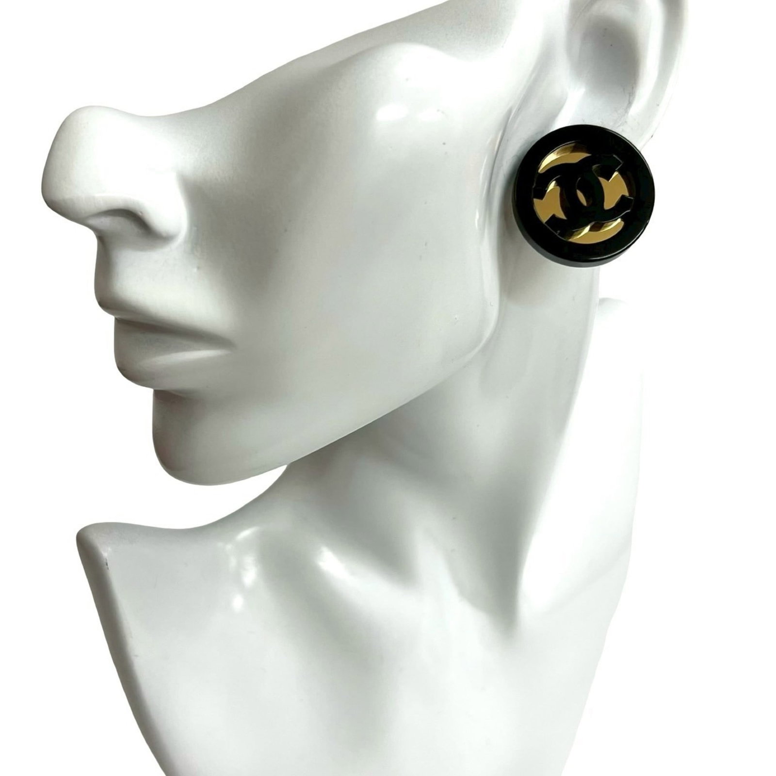 Chanel Stud Earrings Gold Plating Plastic: Chanel Stud Earrings Gold Plating Plastic Gold-plated and made from plastic, these Chanel stud earrings feature a sleek black finish. With their classic design and gold accents, they add a touch of lu